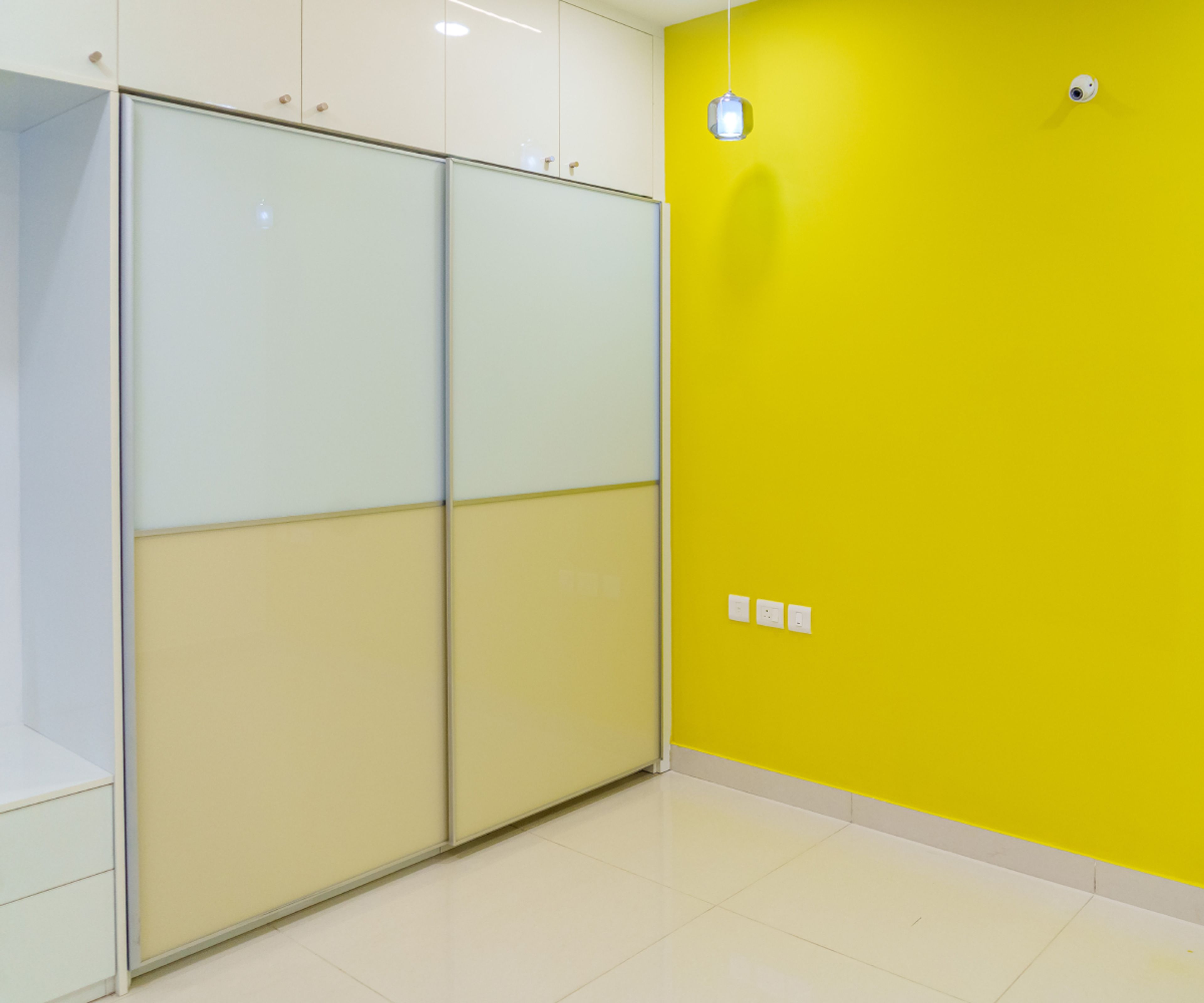Guest Bedroom Design with 2-Door Sliding Wardrobe and Yellow Wall