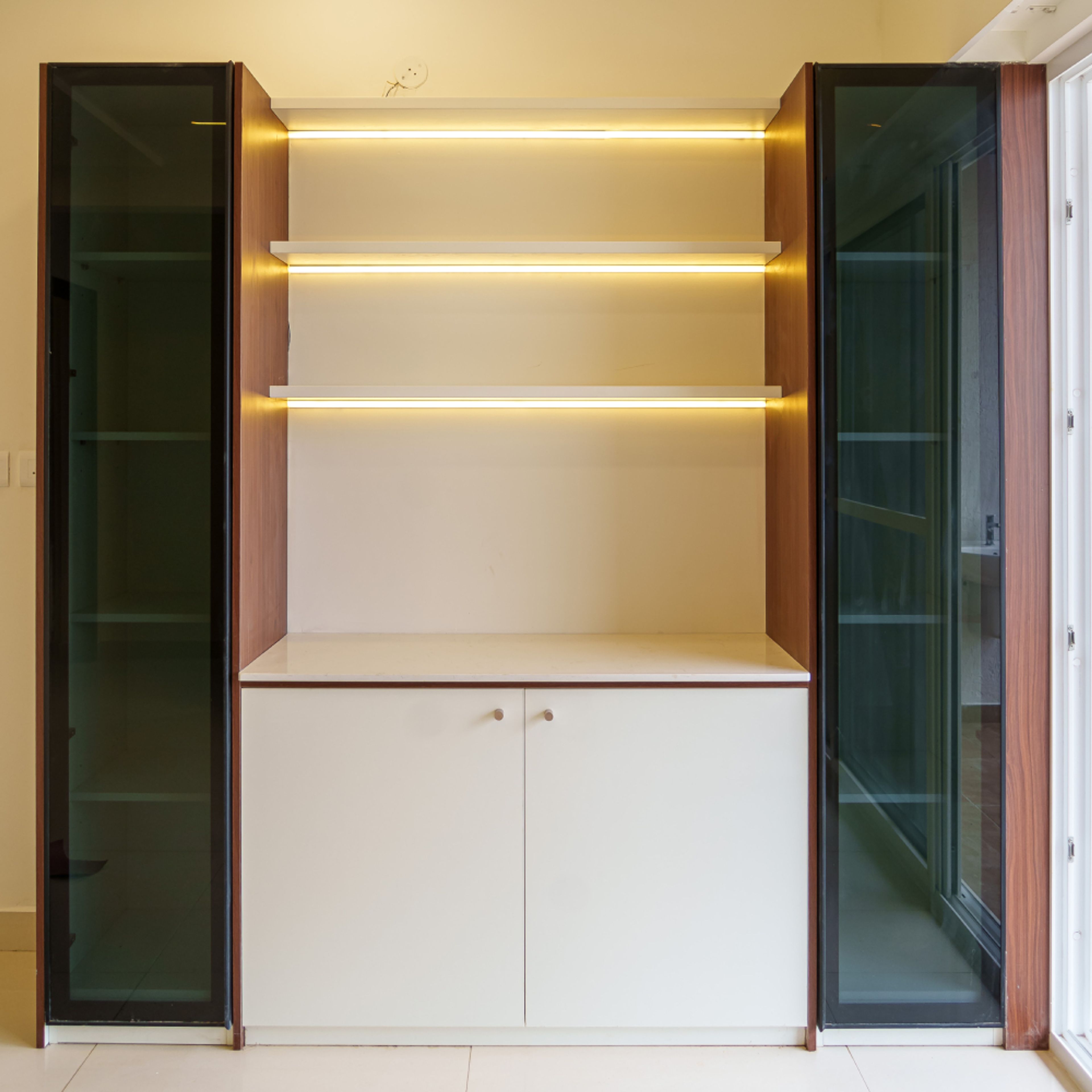 Crockery Unit Design with White Cabinet and Wooden Tall Unit with Glass Shutters