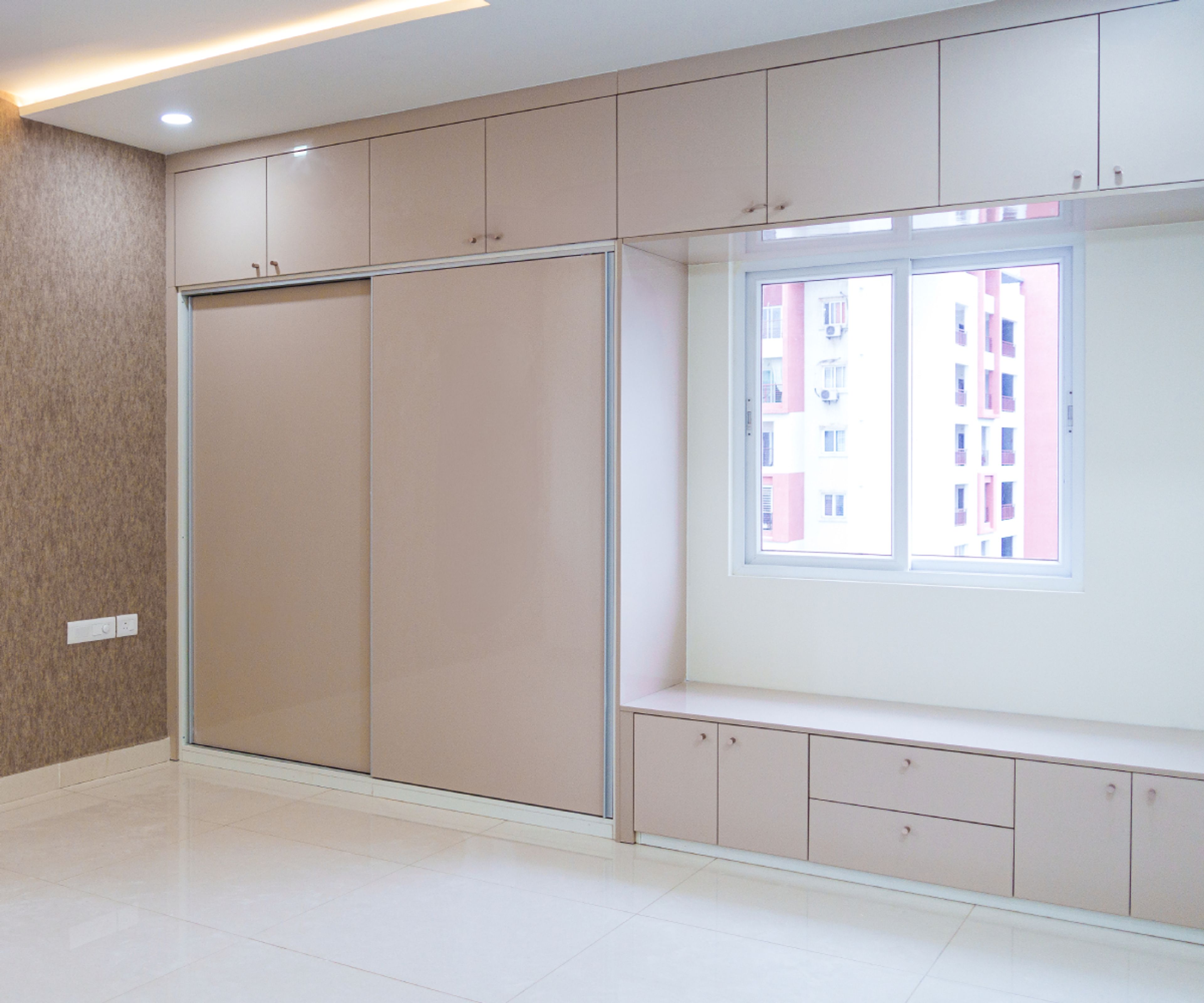 Peach 2-Door Sliding Wardrobe Design with Loft Unit and Seating Bench