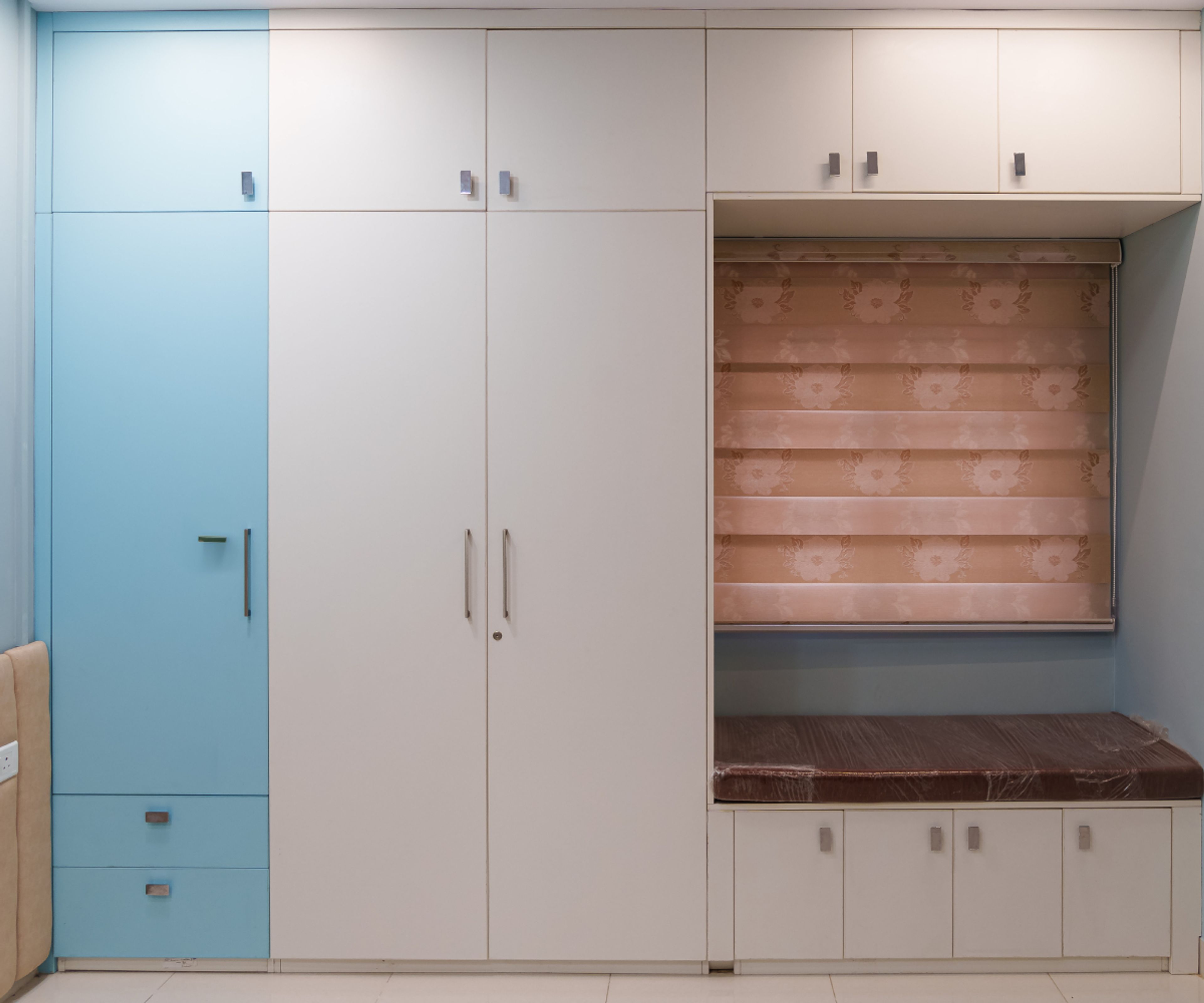 3-Door White and Blue Swing Wardrobe Design with Cushioned Seating Bench