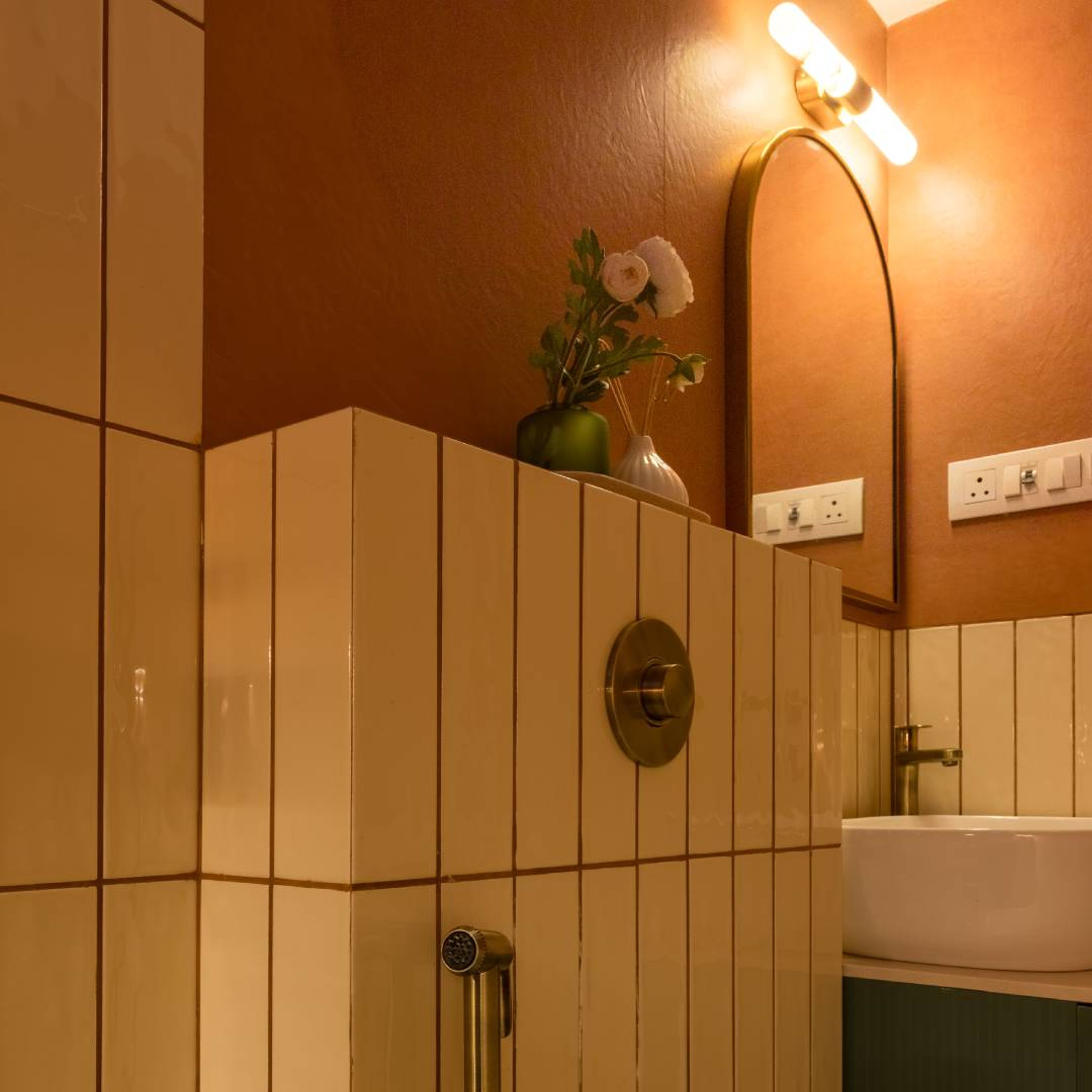 Bathroom Design with Cream wall Tiles and Rust Orange Wall