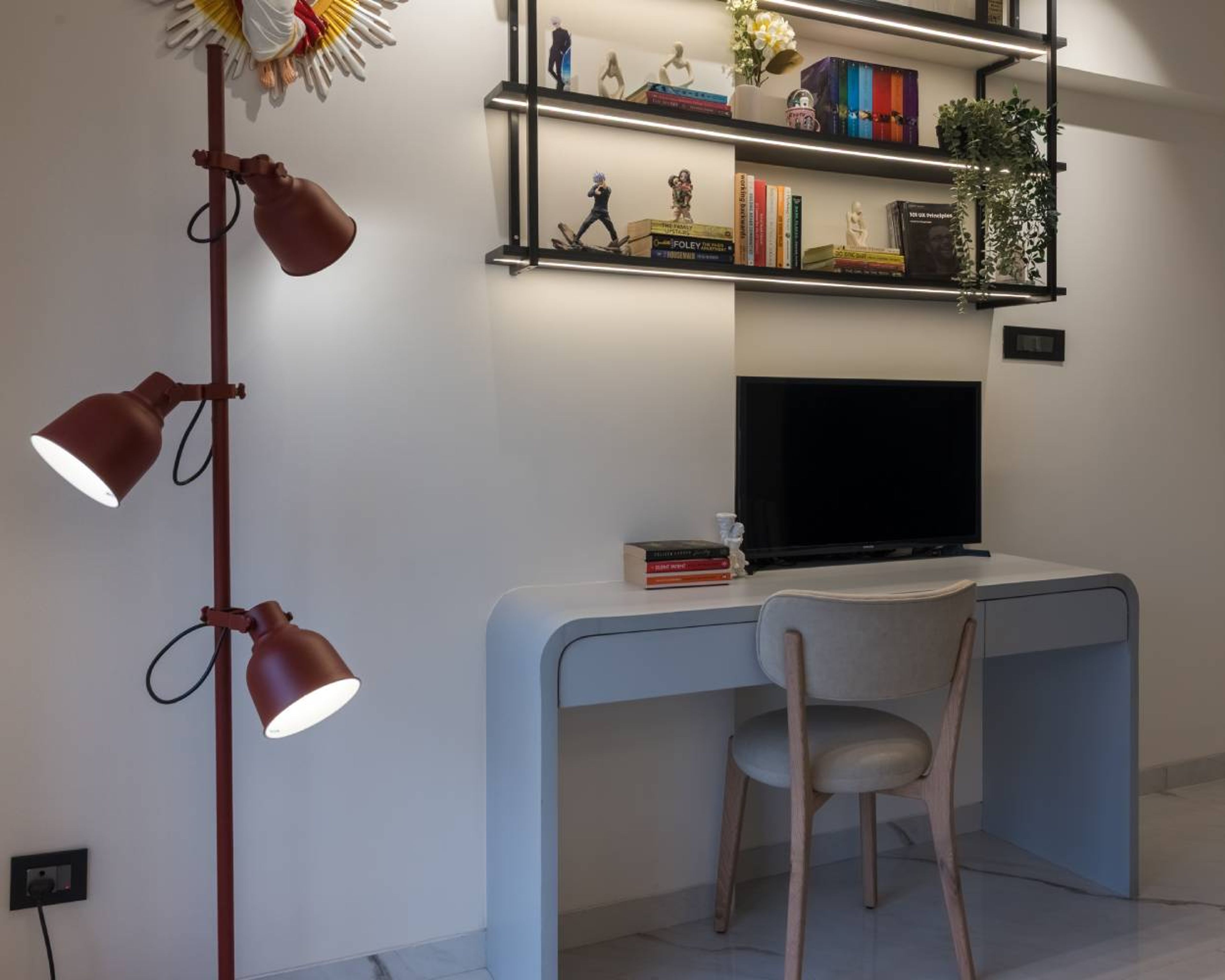 Denim-Toned Modern Home Office Design With Spotlight Shelving and Accent Lighting