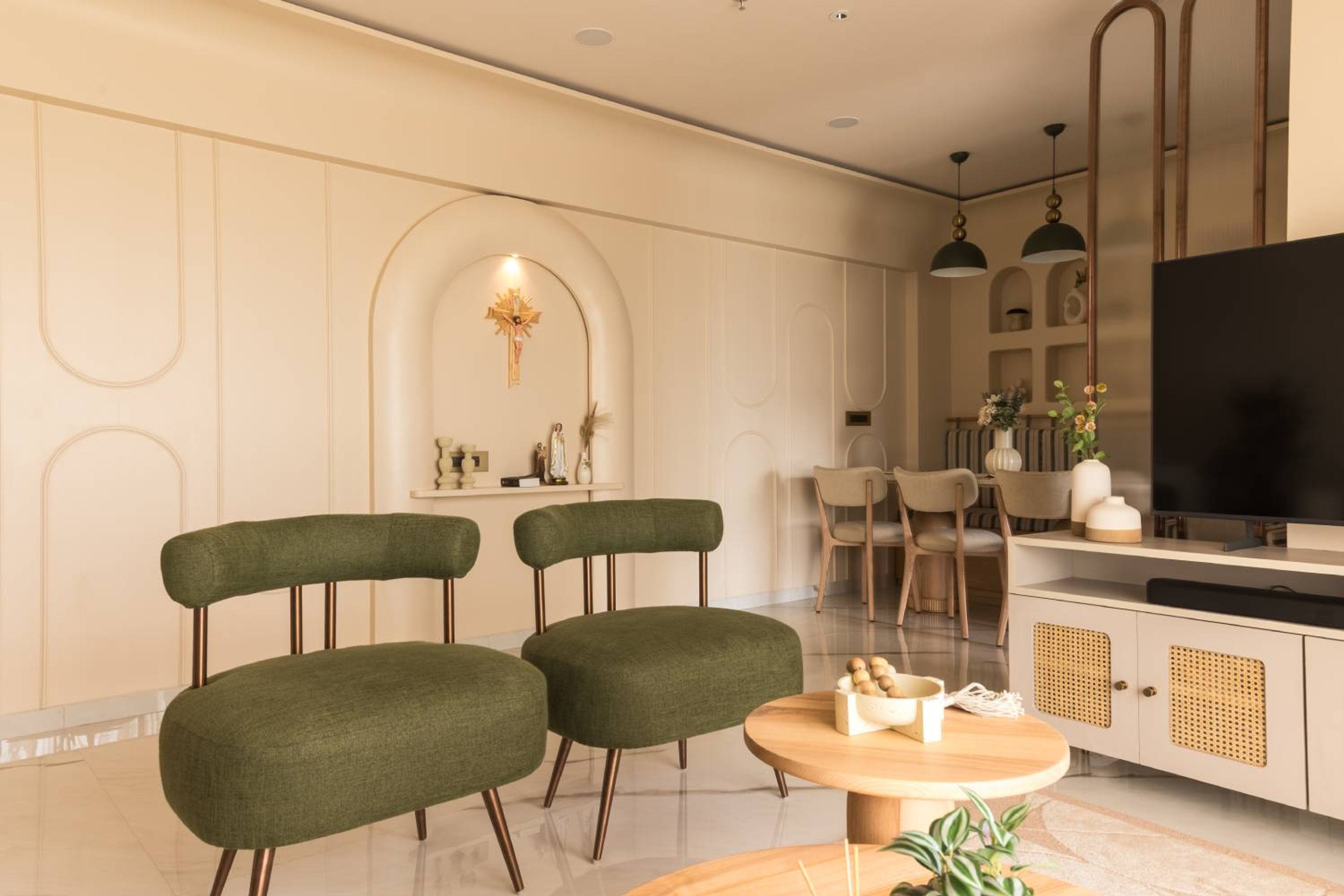 Living Room Design with Two Green Accent Chairs and Cream Arched Trims Wall