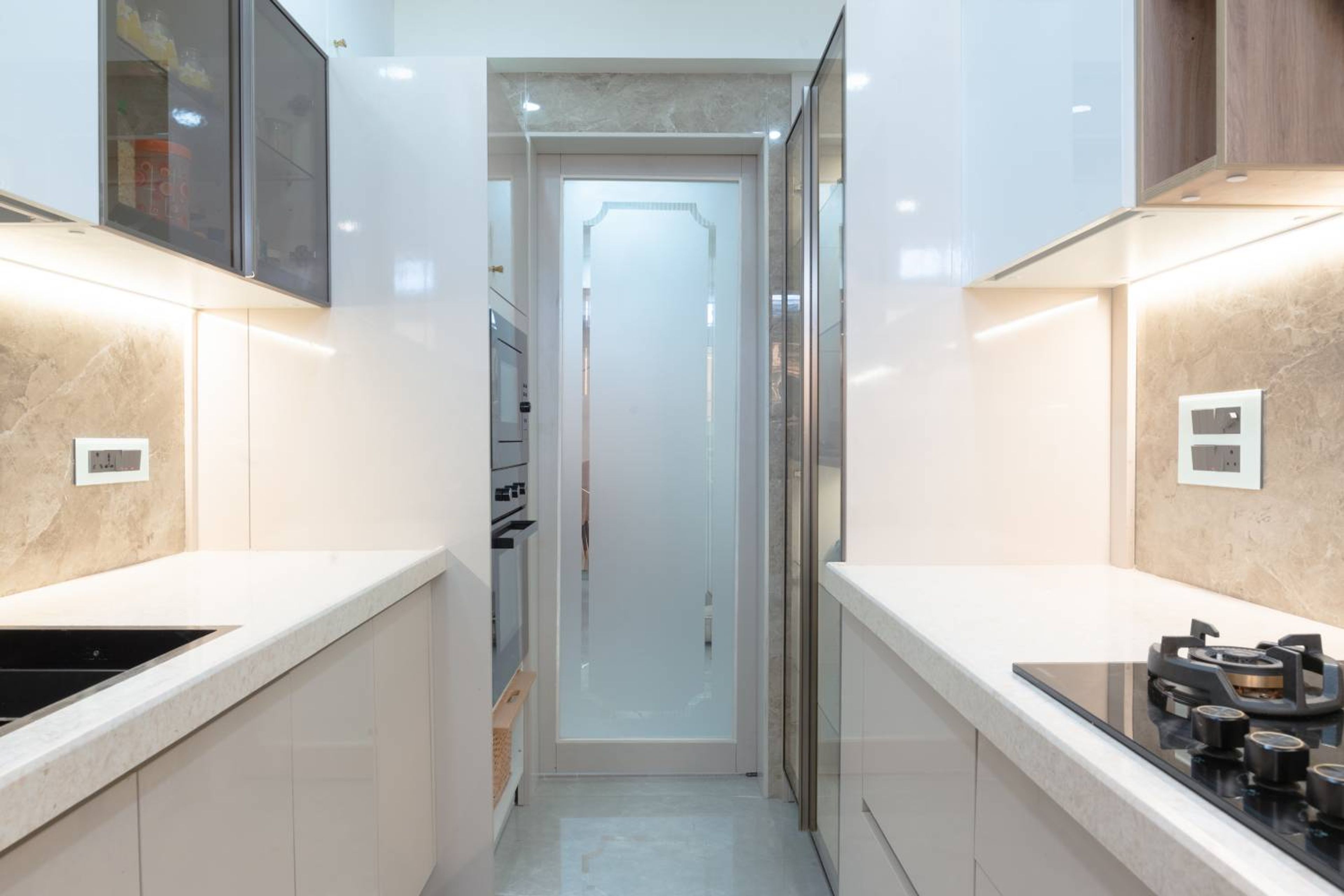 Parallel Kitchen Design with Under Cabinet Lighting and Quartz Countertop