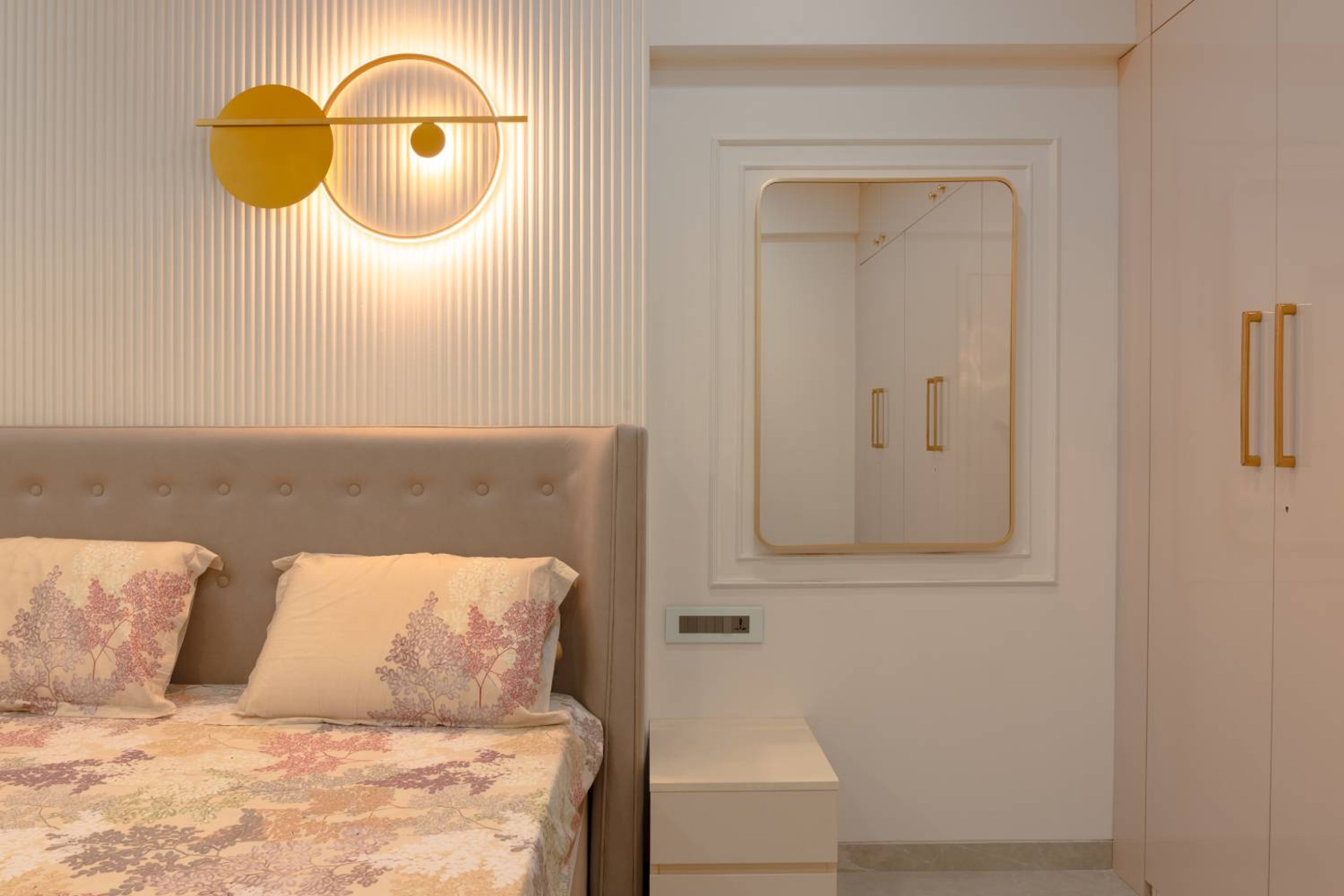 Master Bedroom Design with White Panelled Wall with Cove Light Decor and Mirror
