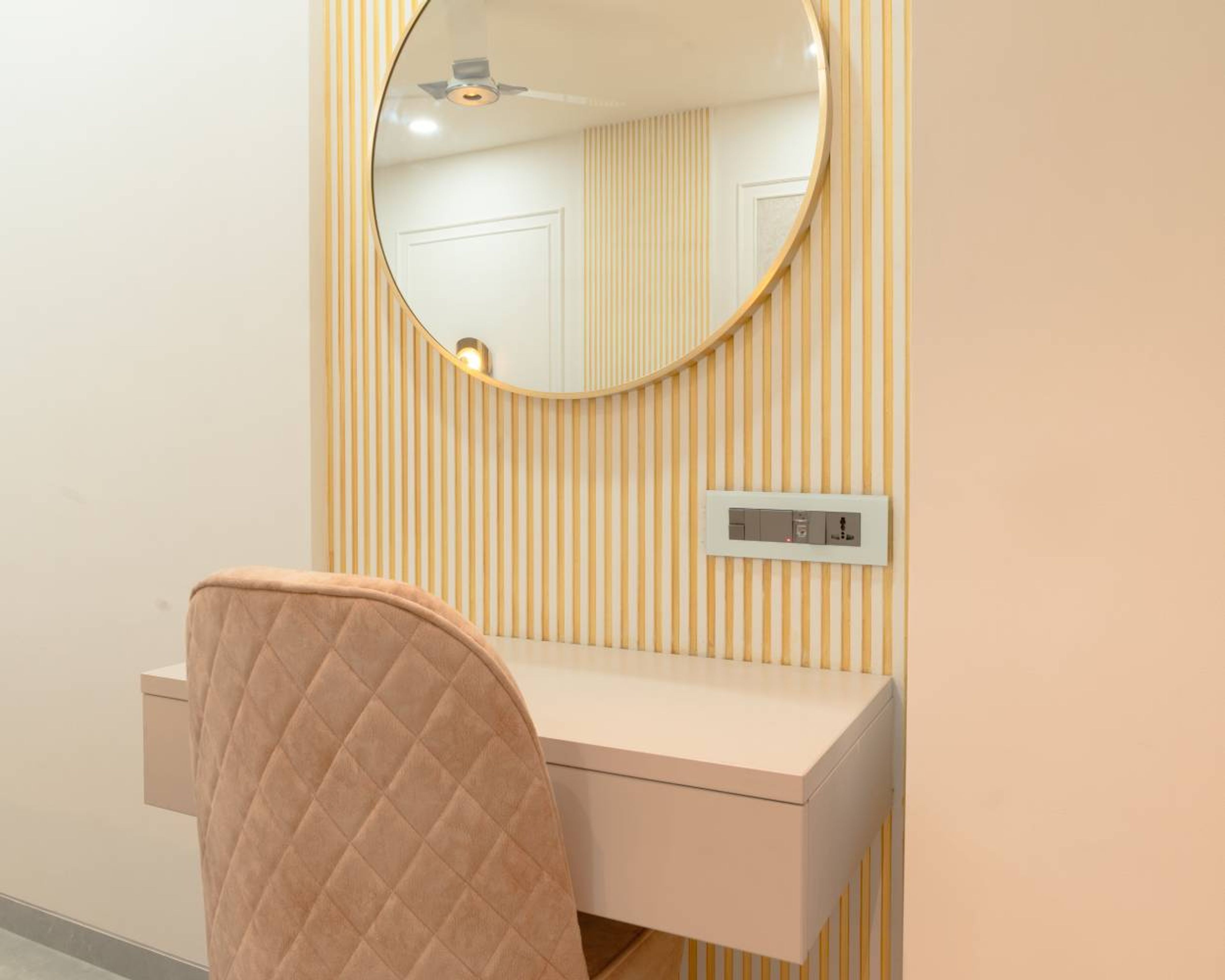 Study Space with Wall Mounted Mirror with Yellow and White Striped Wall and Chair