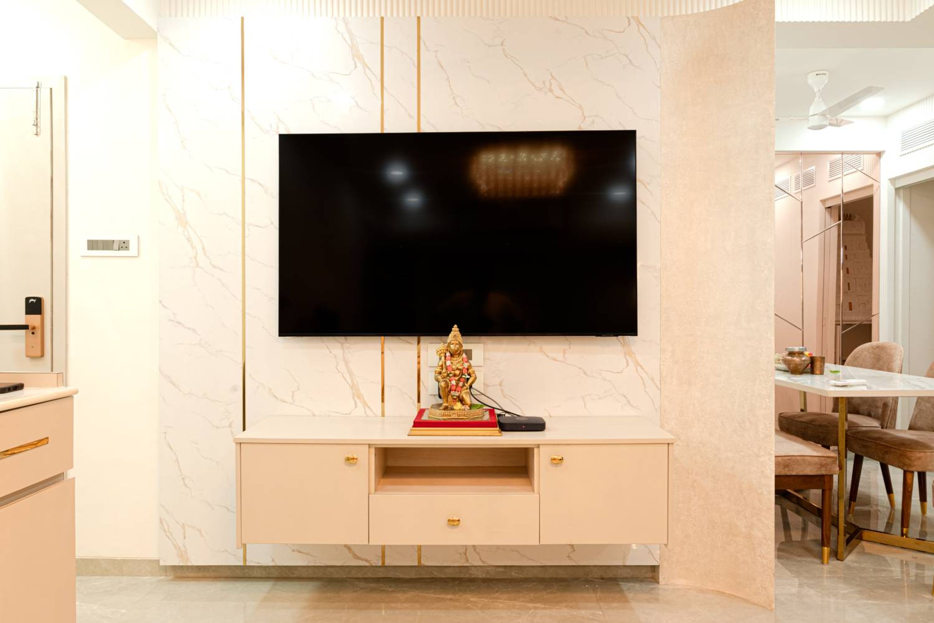 TV Unit Design with Marble Patterned Backsplash with Gold Trims and Drawers