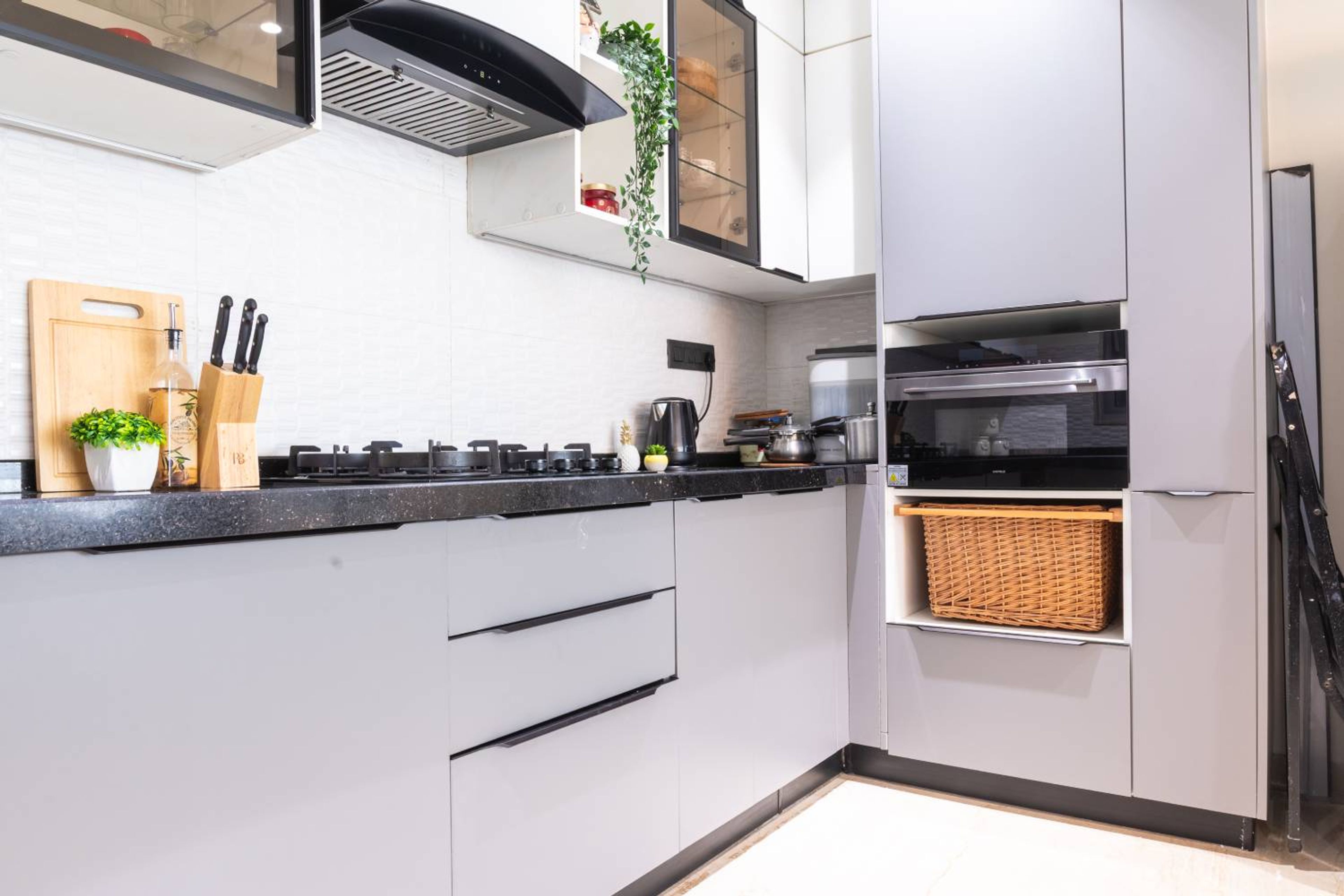 U-shaped kitchen design with grey base units