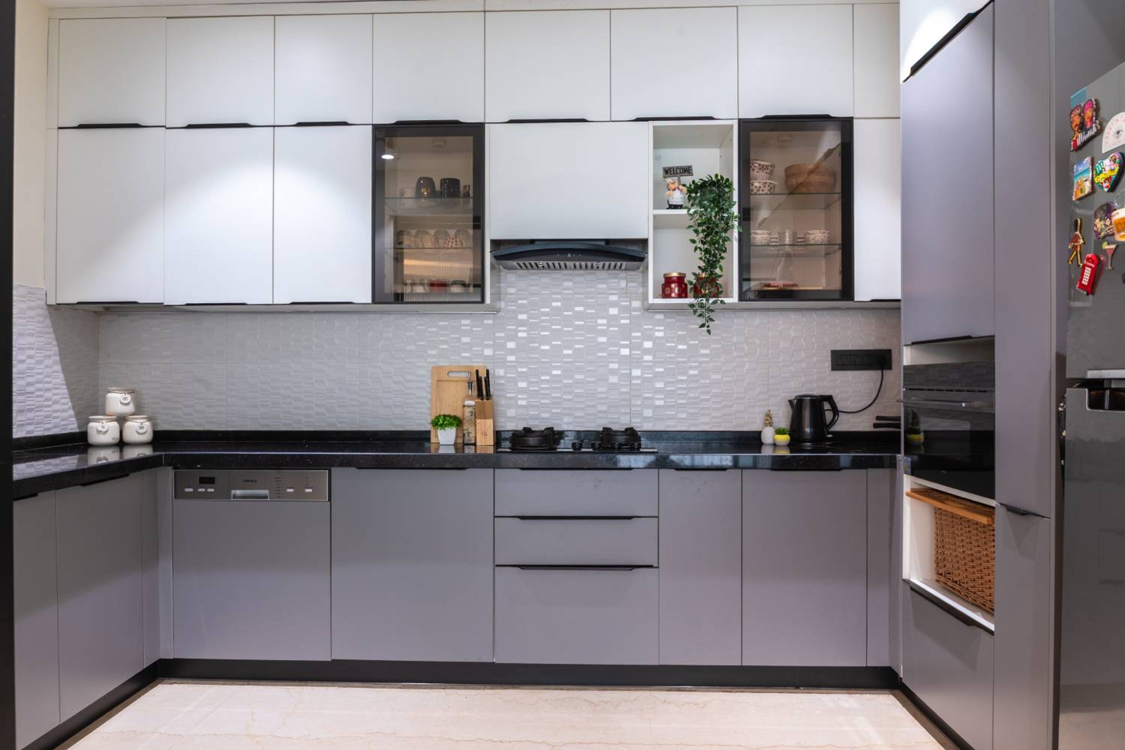 U-shaped kitchen design with grey and white units