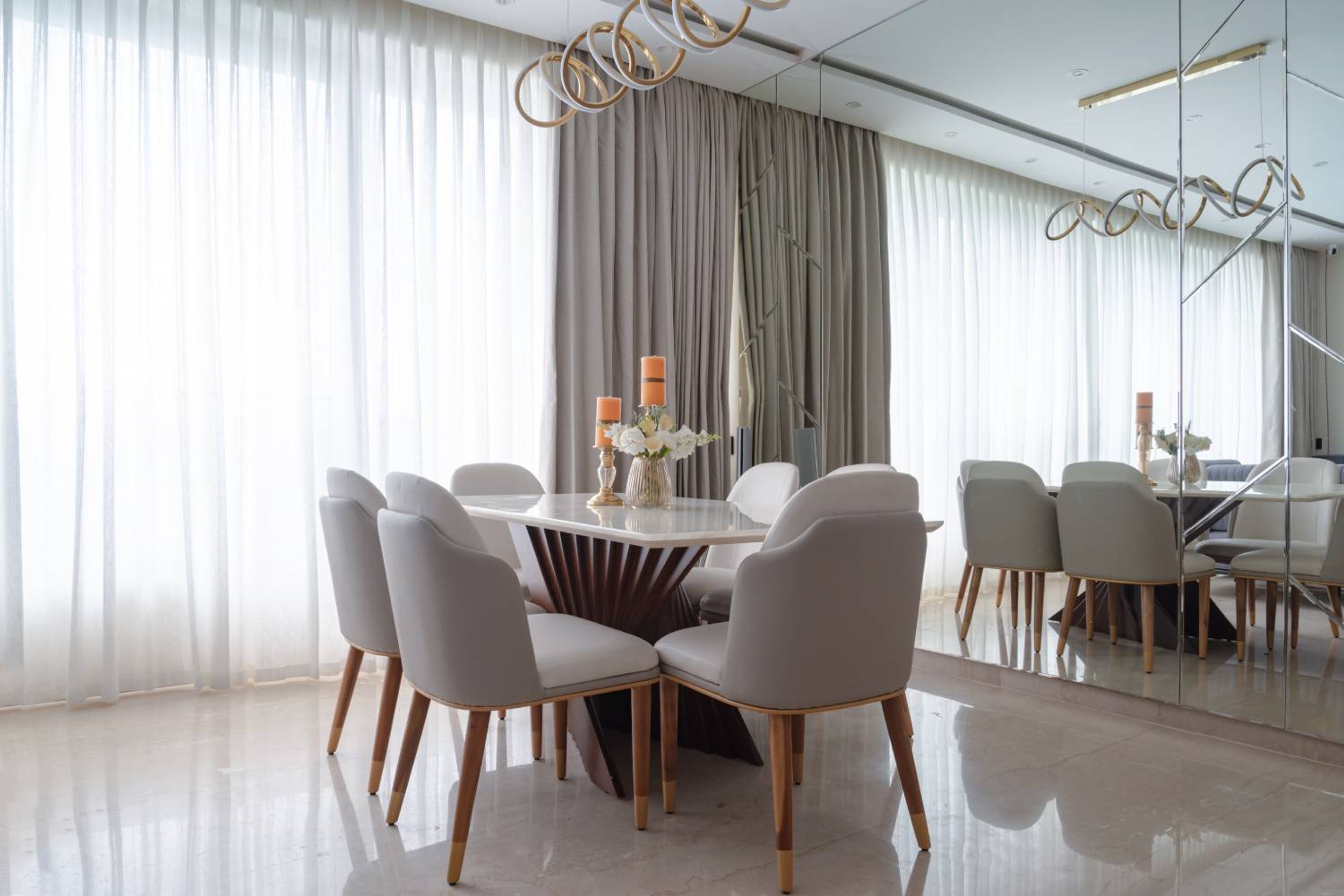Dining Room Design with Marble Table and High-Back Chairs