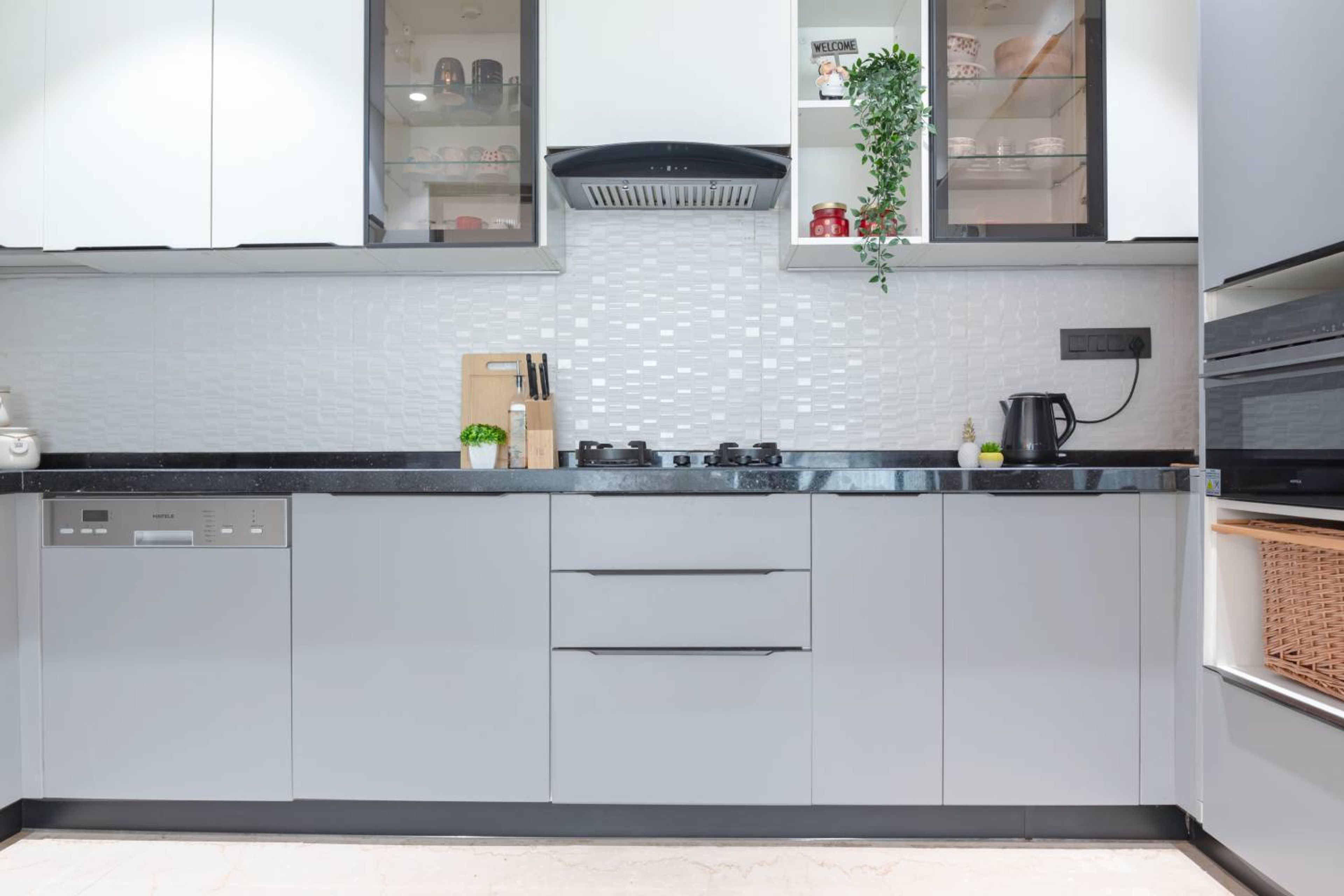 Minimal L-Shaped Kitchen Design with Smoke Grey and Frosty White Finishes