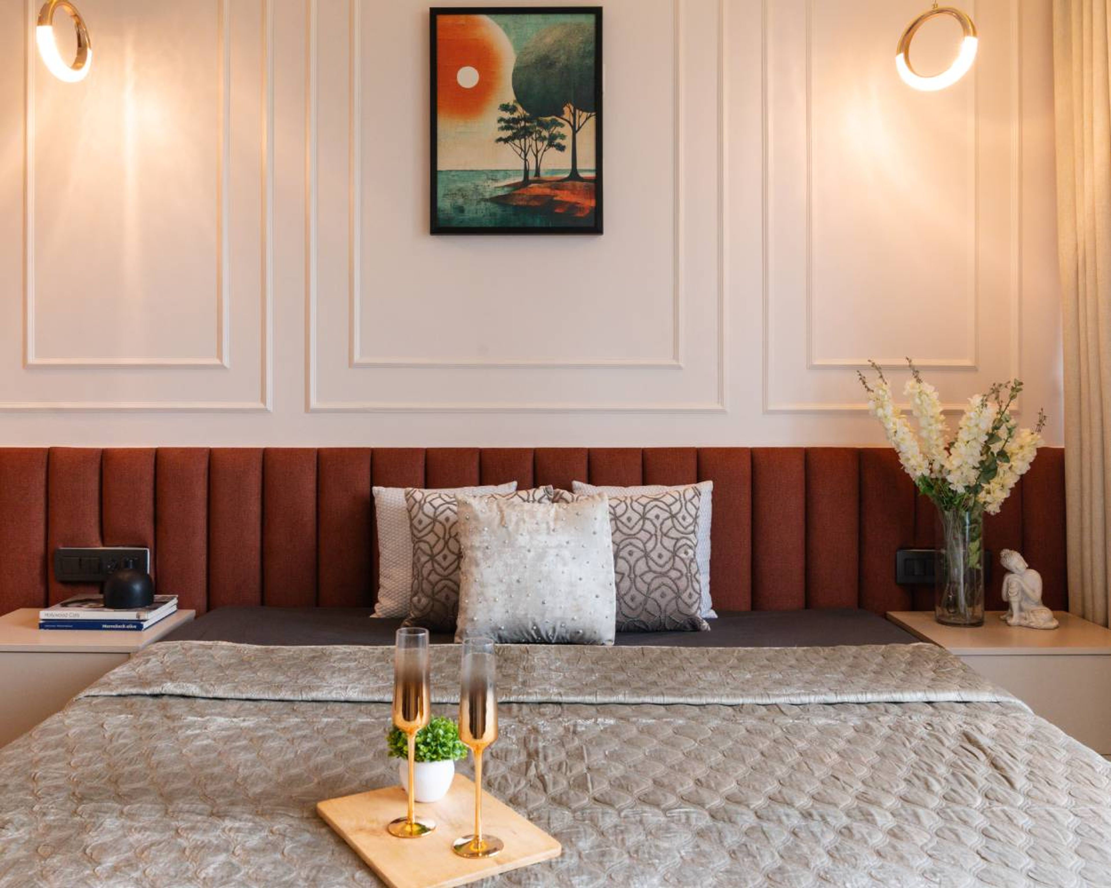 Bedroom design with white wall with trims and orange cushioned headboard wall