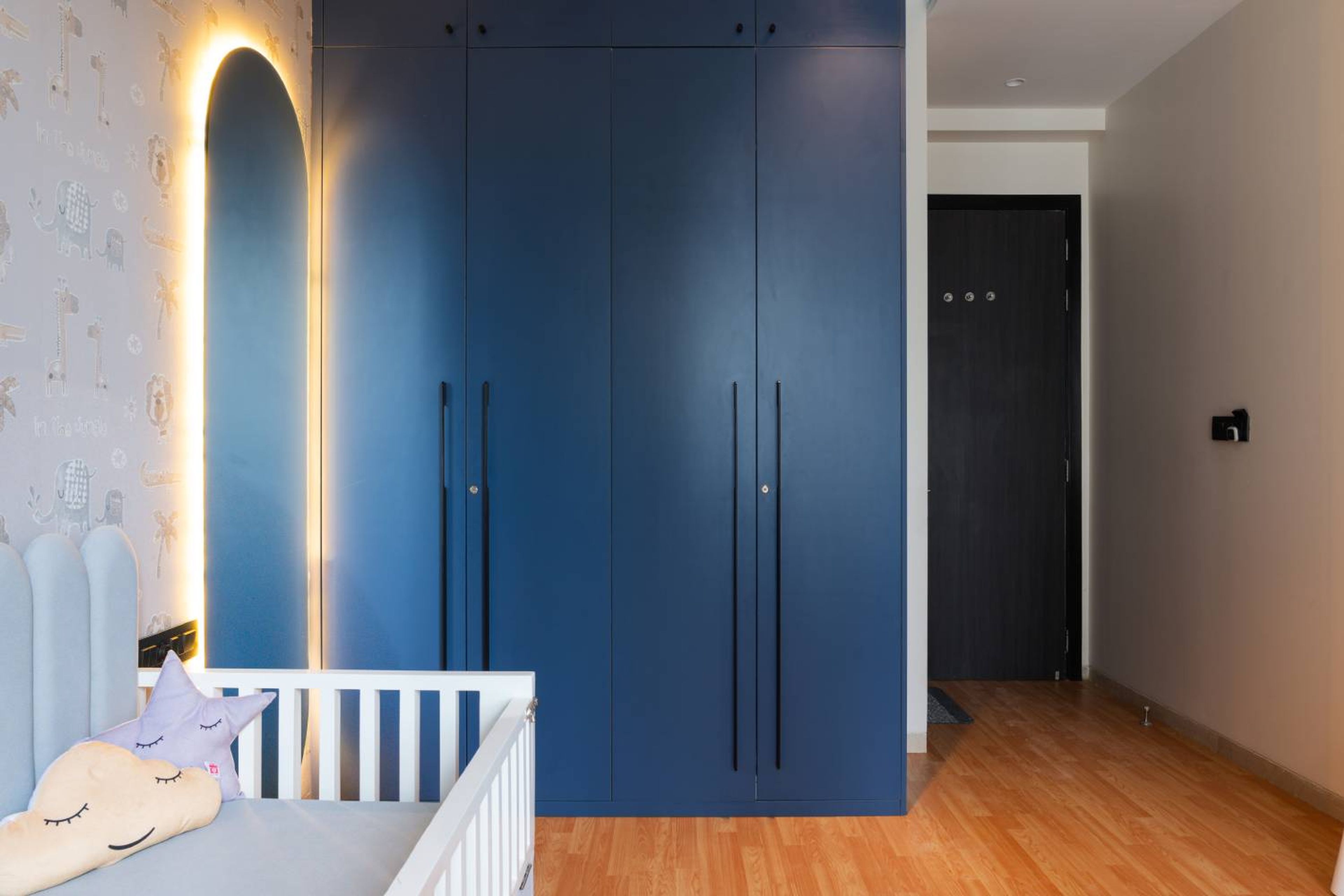 Kids bedroom design with blue 4-door swing wardrobe