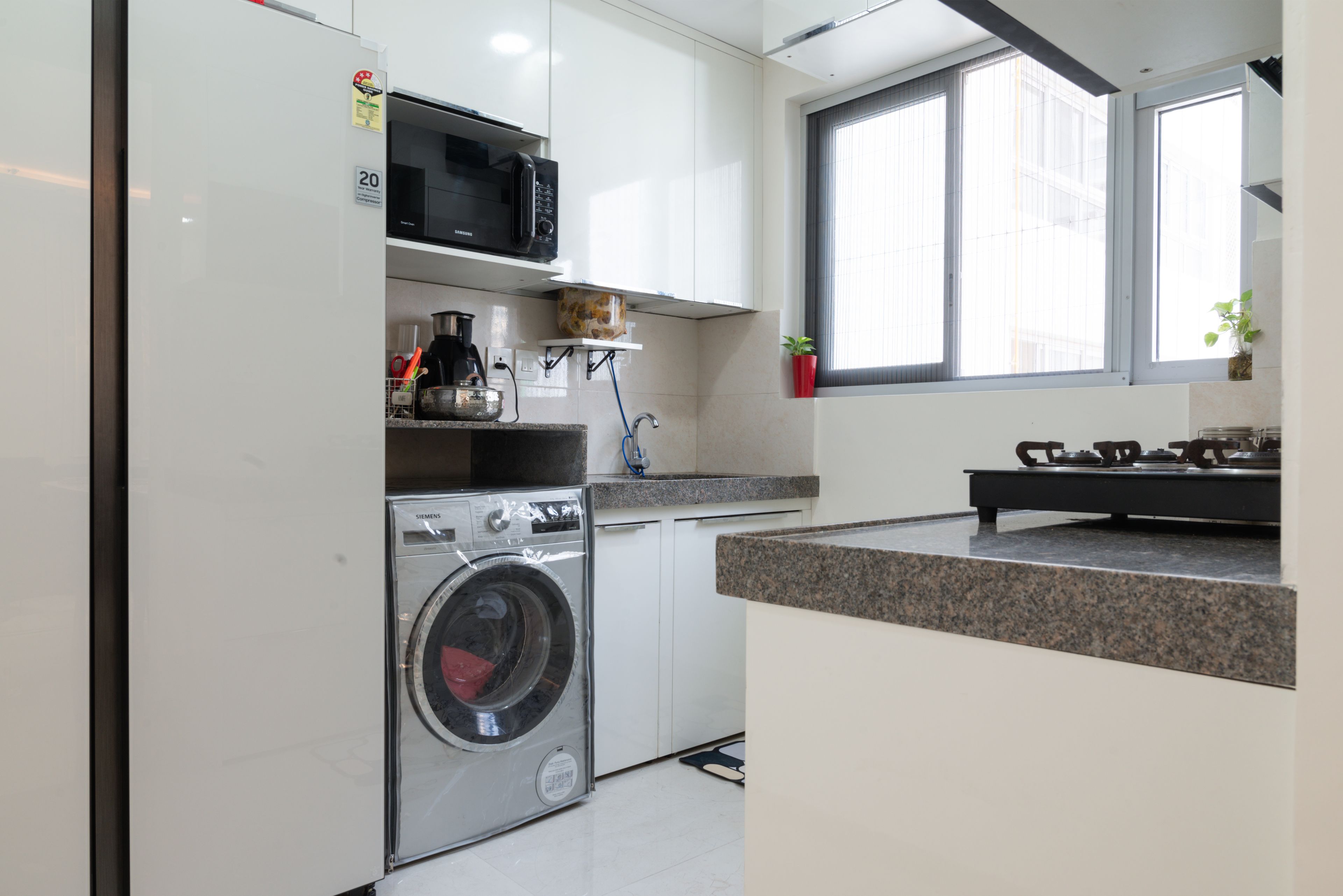 Parallel Kitchen Design with White Wall Units and Appliance Storage Space
