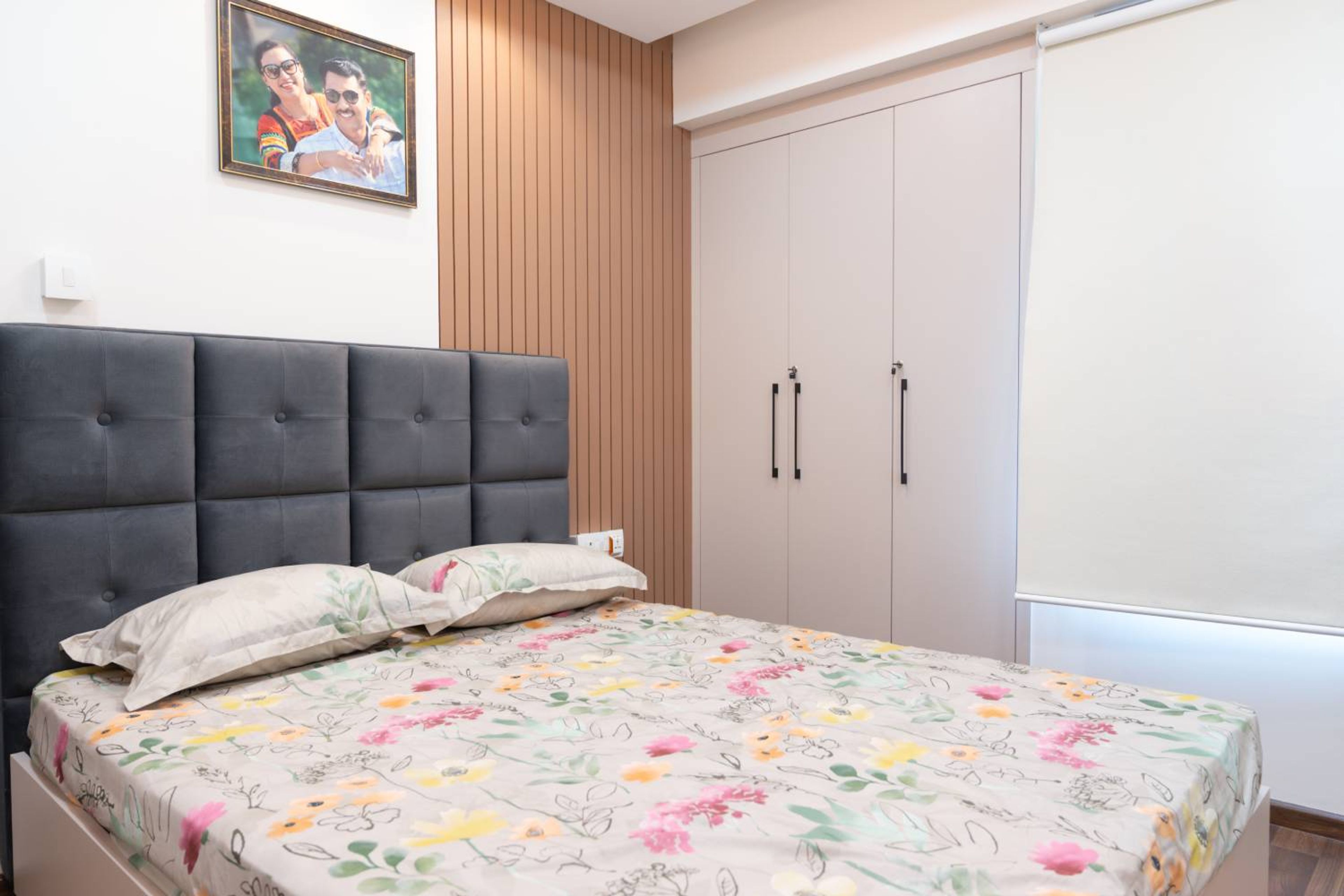 Master Bedroom Design with Grey Headboard Bed, 3-Door Beige Swing Wardrobe and Wooden wall Slats