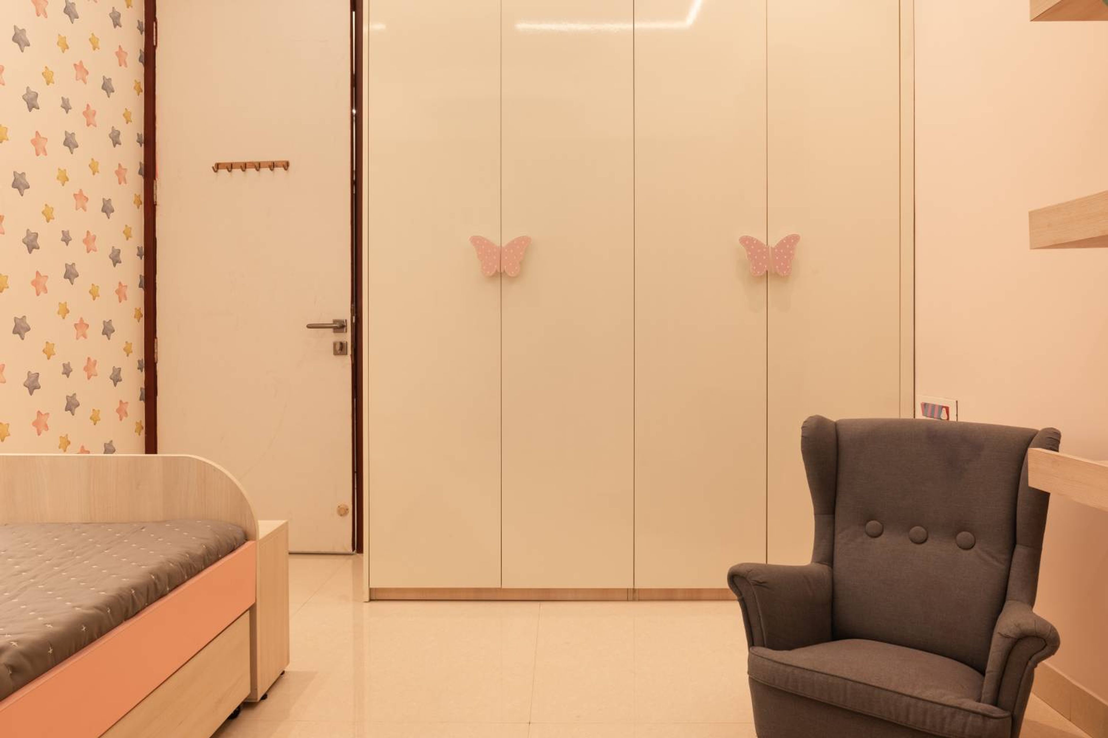 4-Door Off-White Swing Wardrobe Design with Pink Butterfly Handles