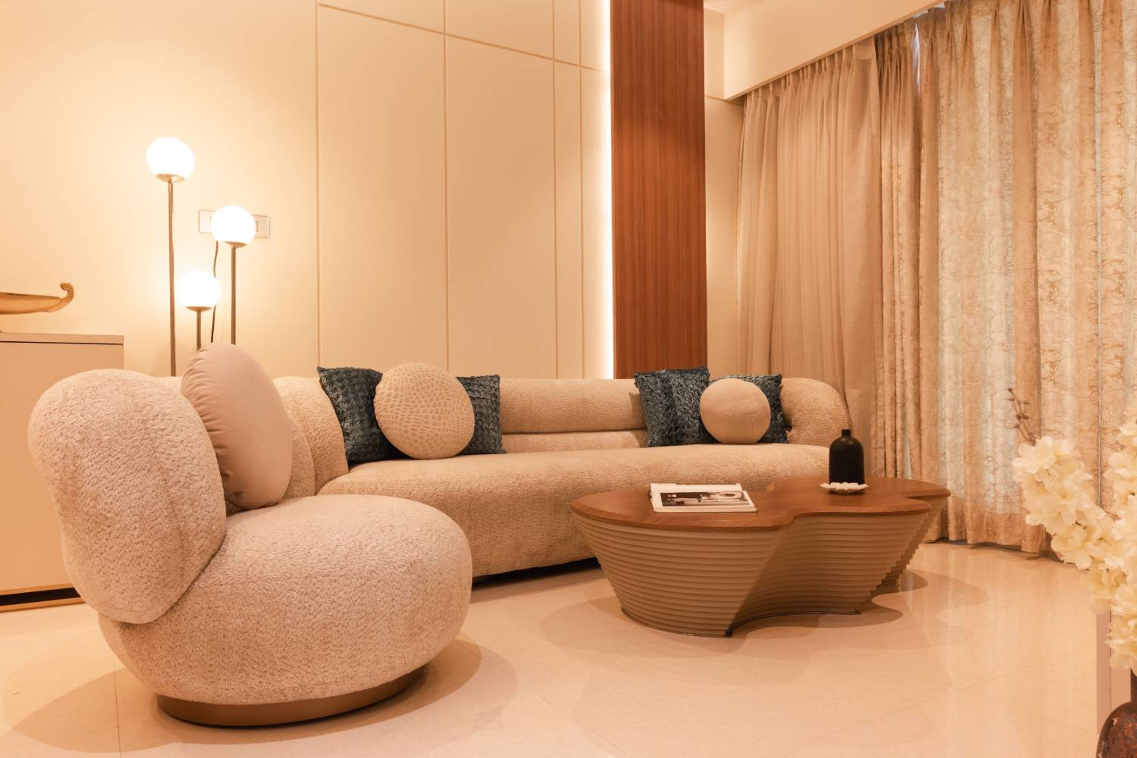 Living Room Design with Off-White Cushioned Sofa and Wooden Central Table