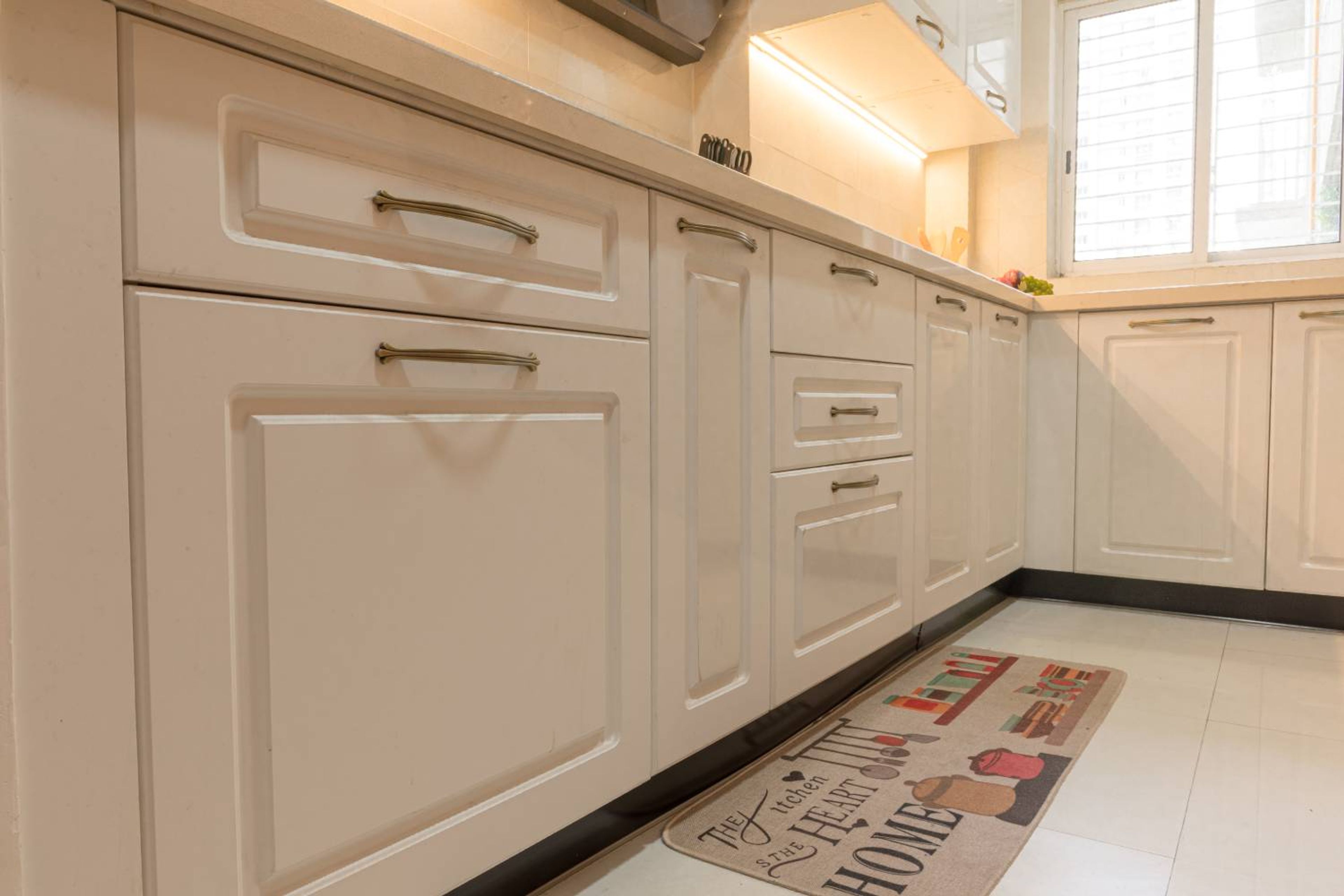 L-Shaped Kitchen Design with Beige Base Units with Profile Shutters