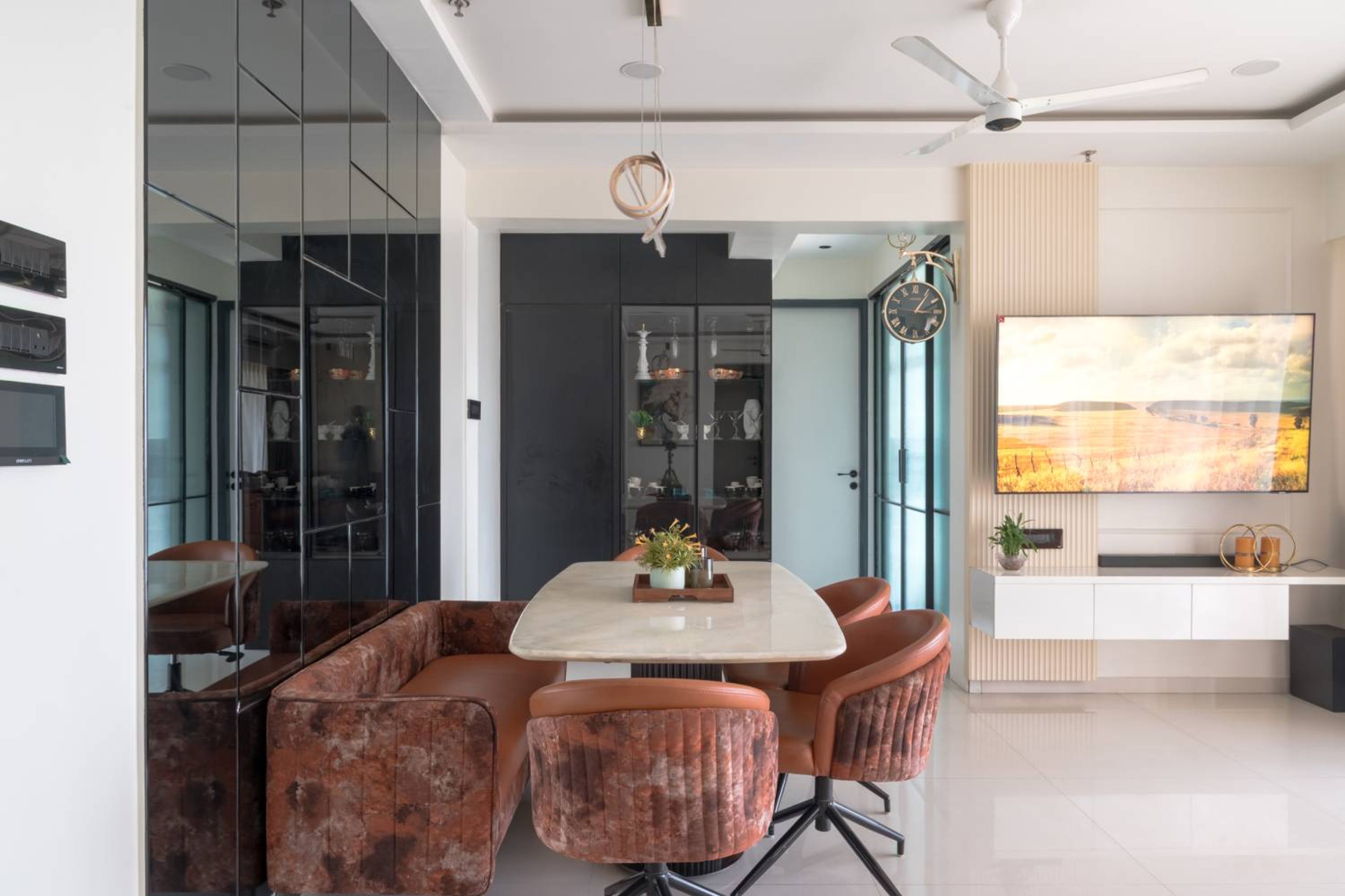 Dining room design with 3 orange chairs and seating bench