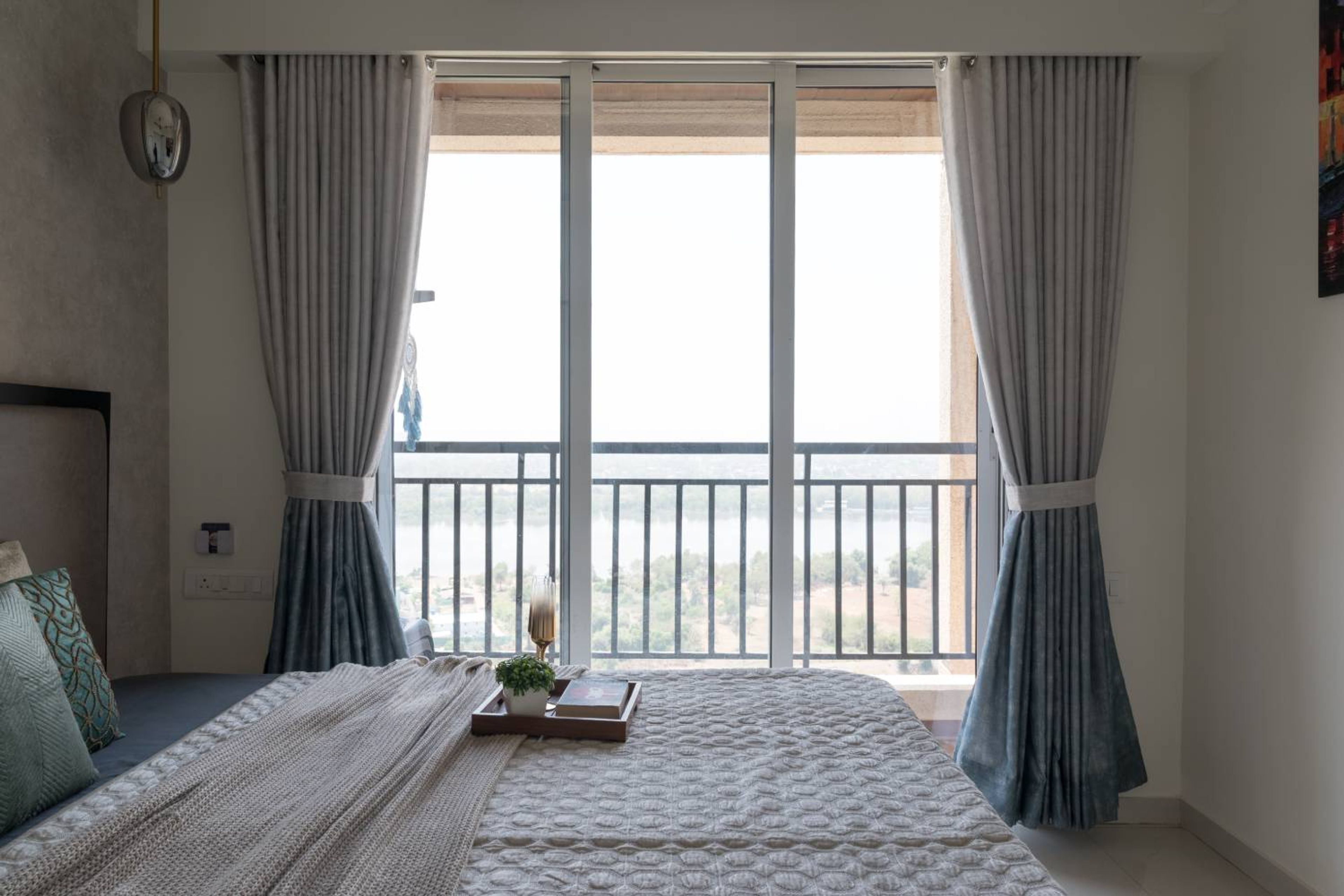 Bedroom design with floor-to-ceiling glass door for balcony