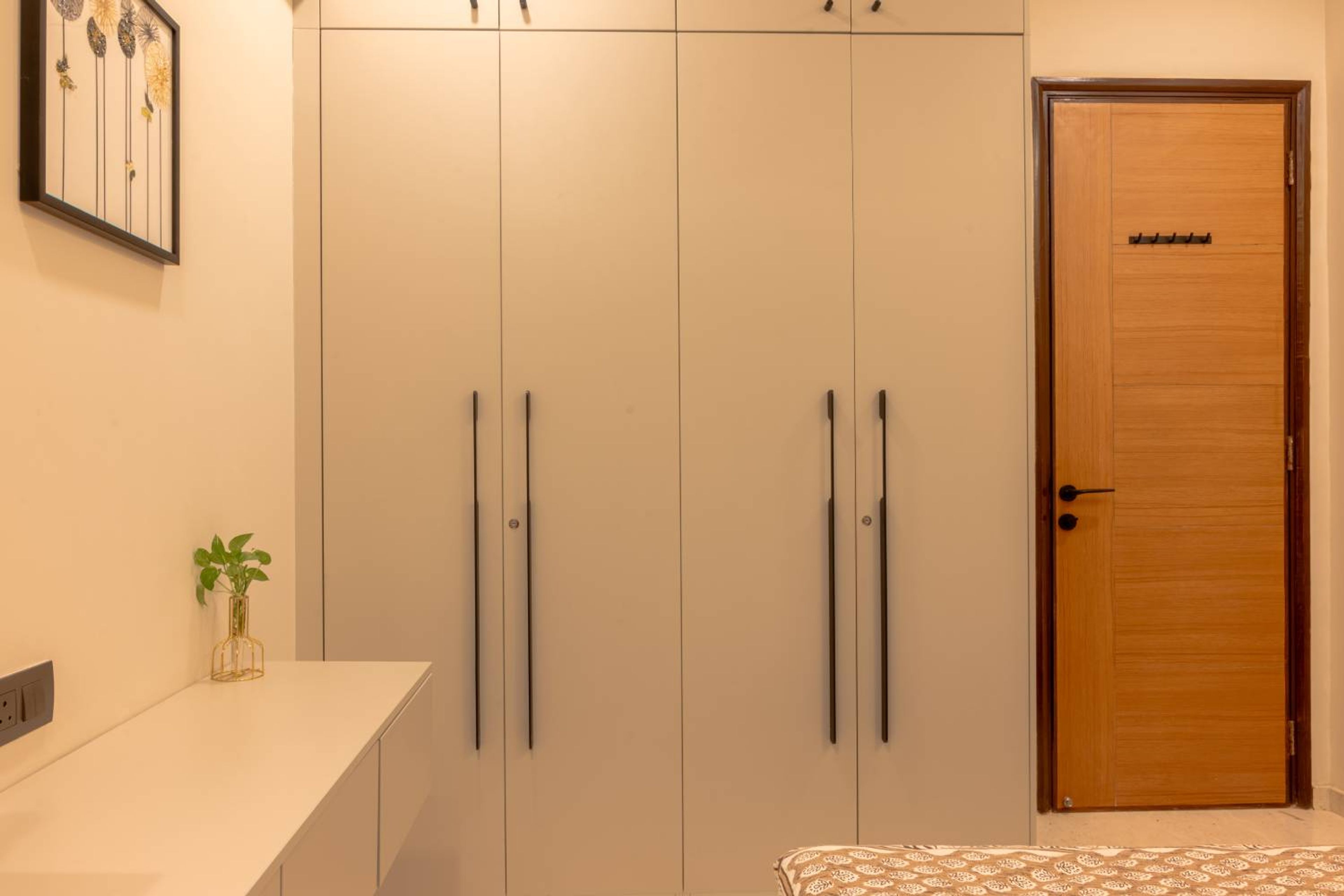 Contemporary 4-Door White Swing Wardrobe Design with Seamless Floor-To-Ceiling Look