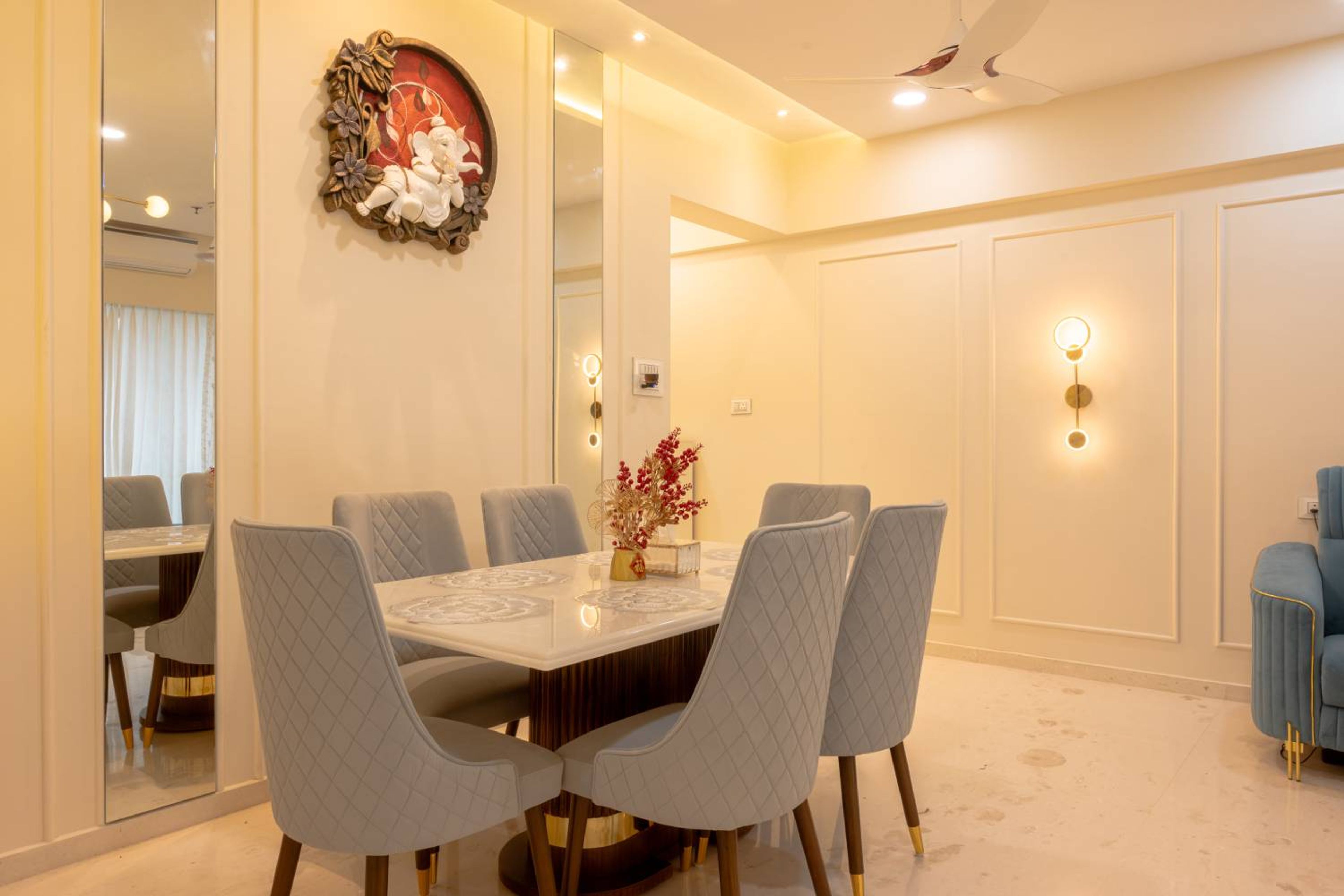 6-Seater Dining Room Design with Grey Cushioned Chairs and Marble Top Table