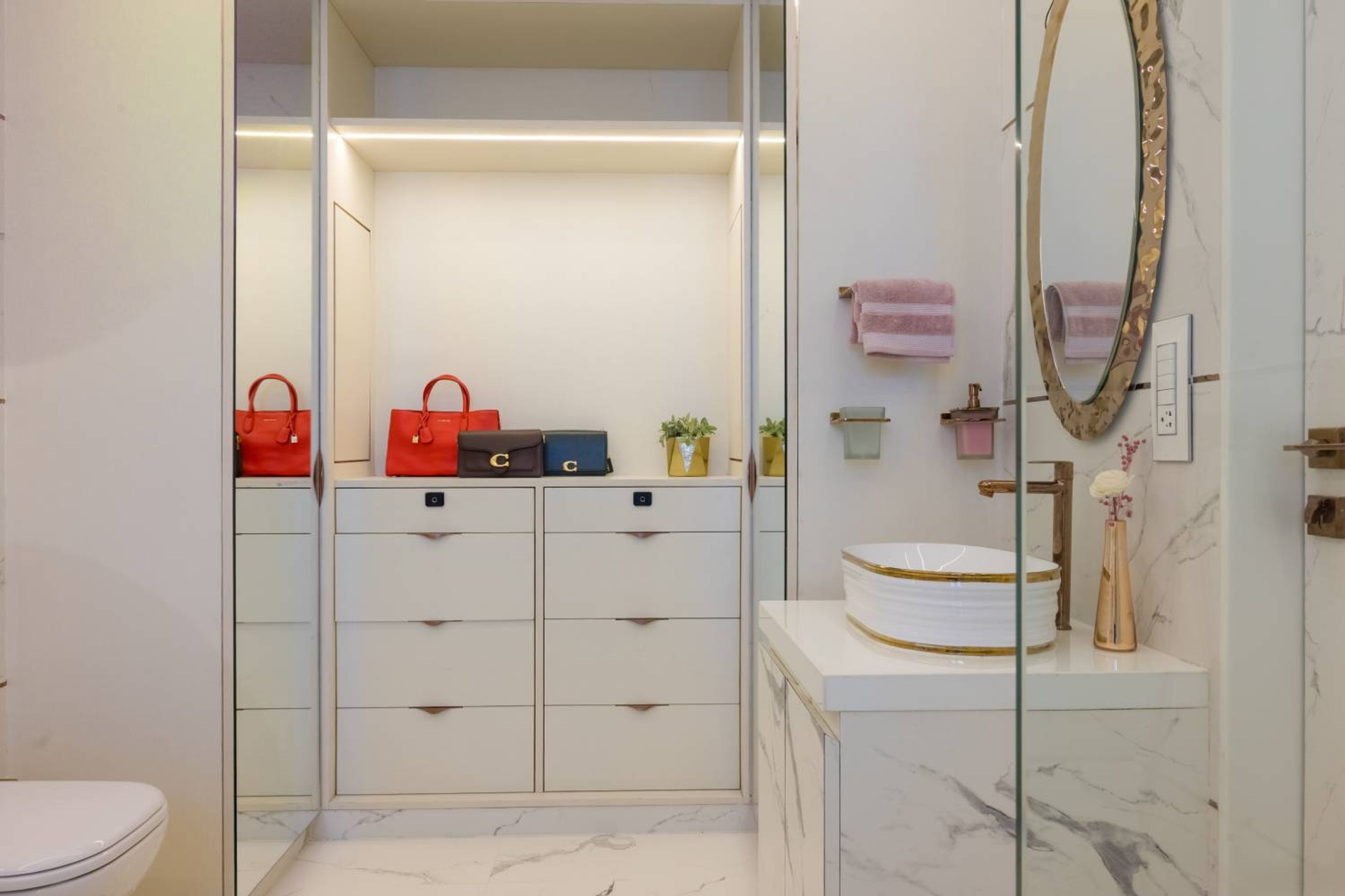 Vanity with white cabinets and mirror