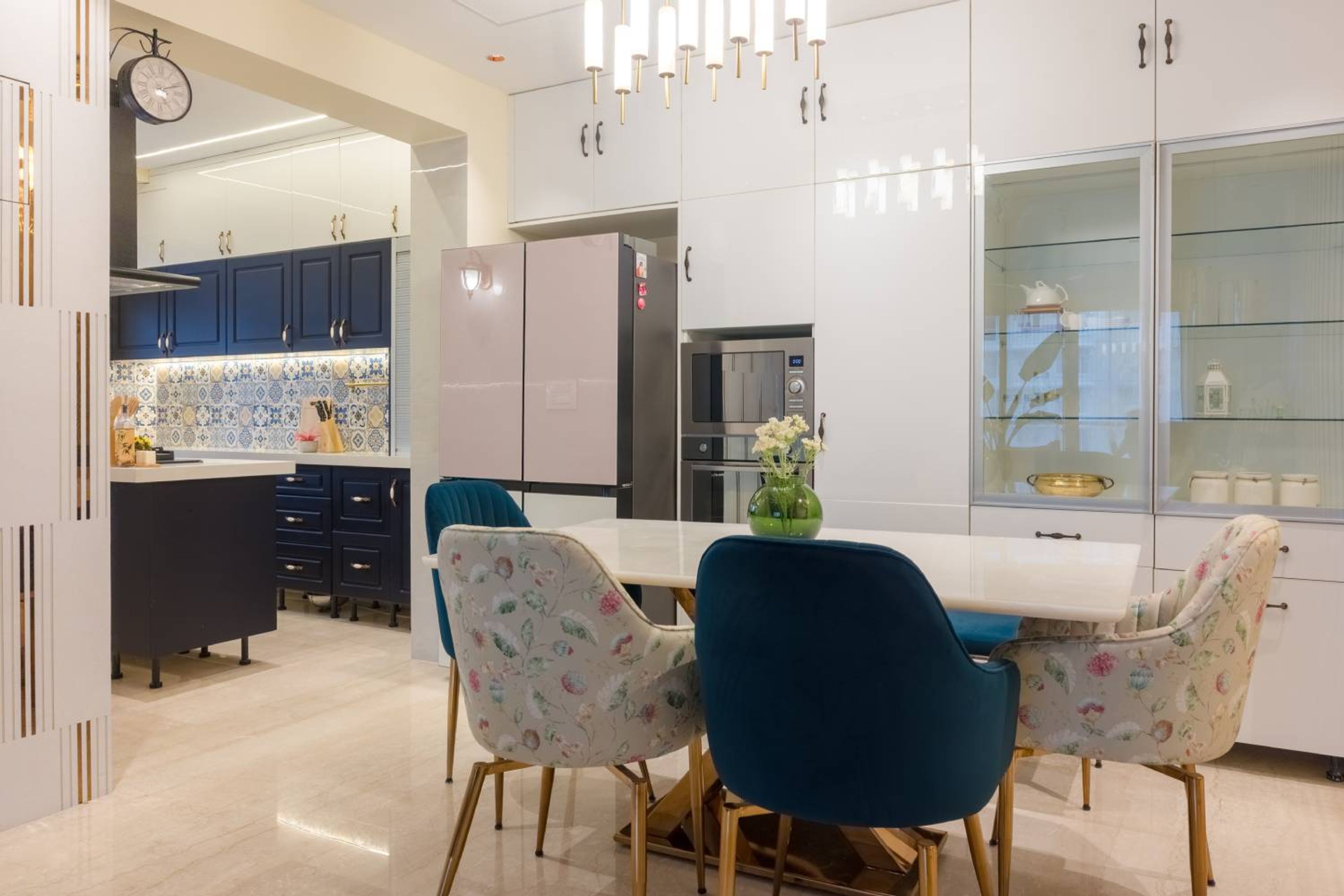 White crockery unit design with 6-seater dining area