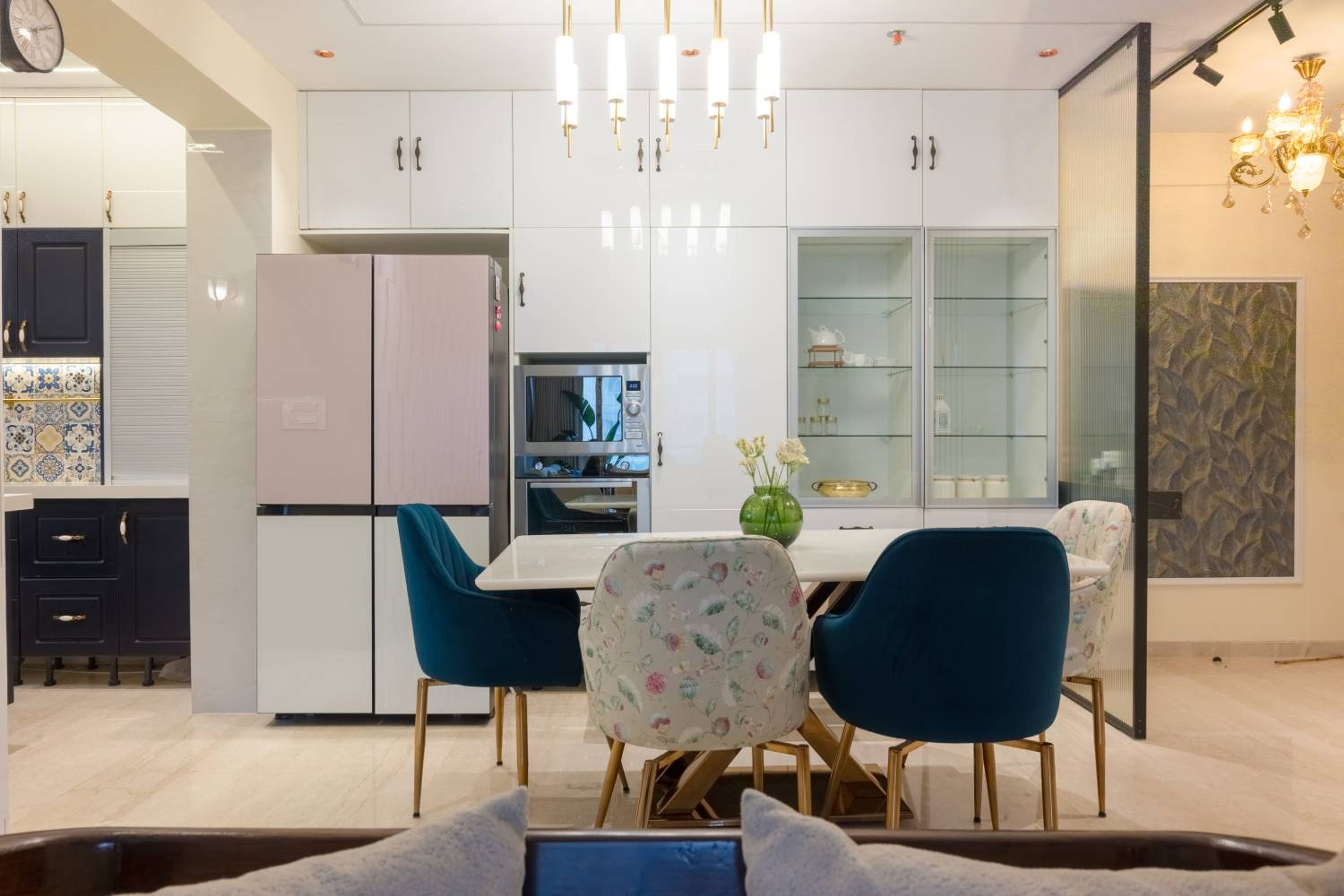 White crockery unit design with 6-seater dining area