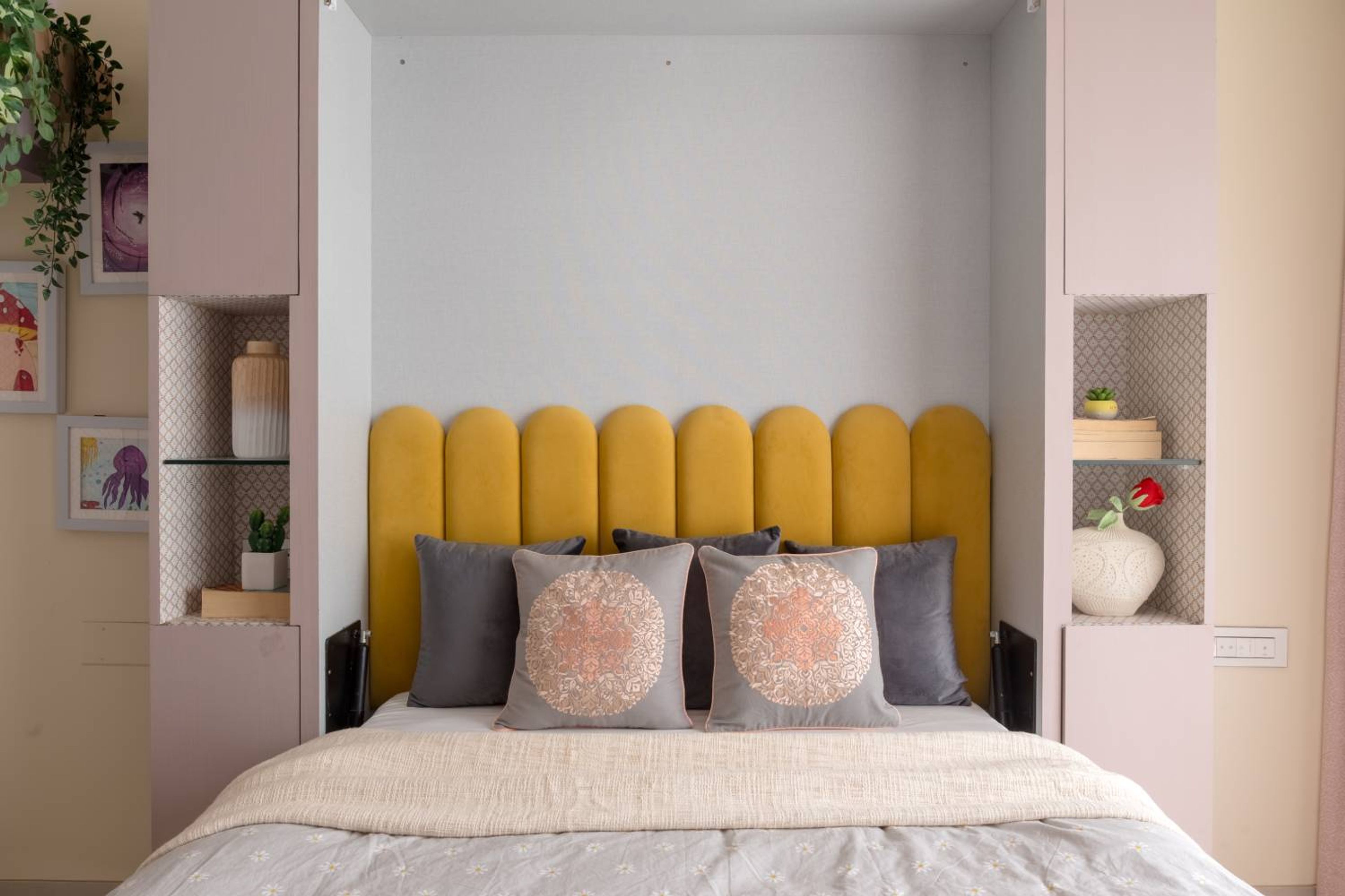 Bedroom design with yellow arched cushioned headboard bed