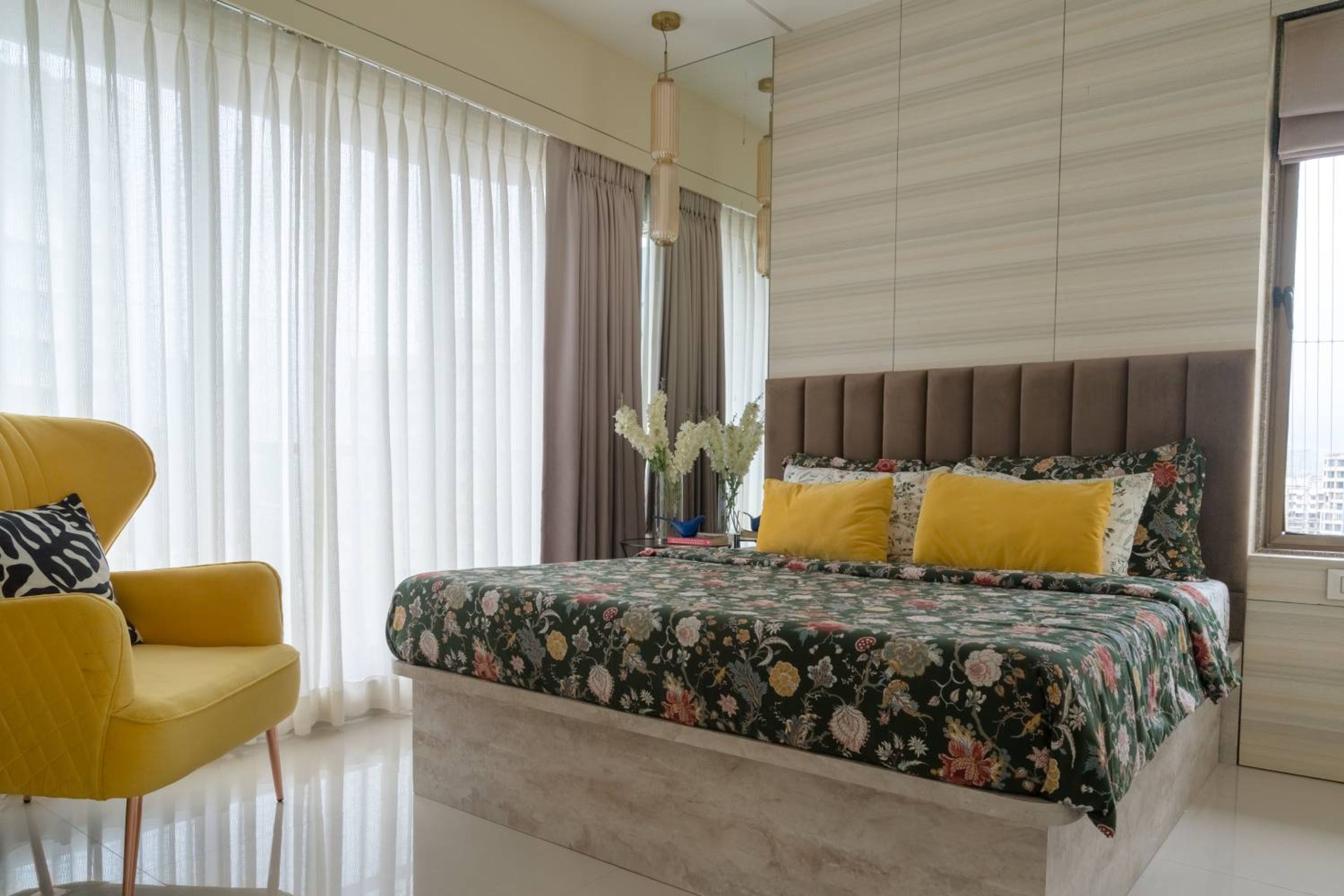 Bedroom design with yellow accent chair