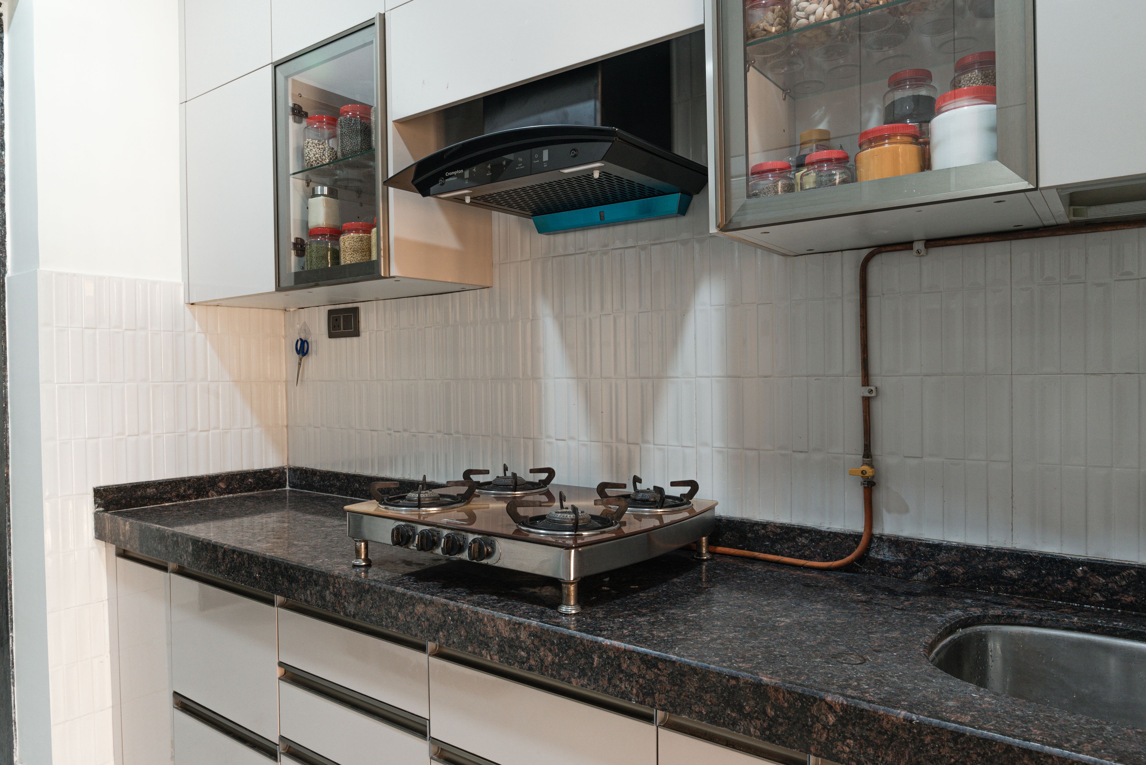 Parallel Kitchen Design with Granite Countertop and White Tiled Backsplash