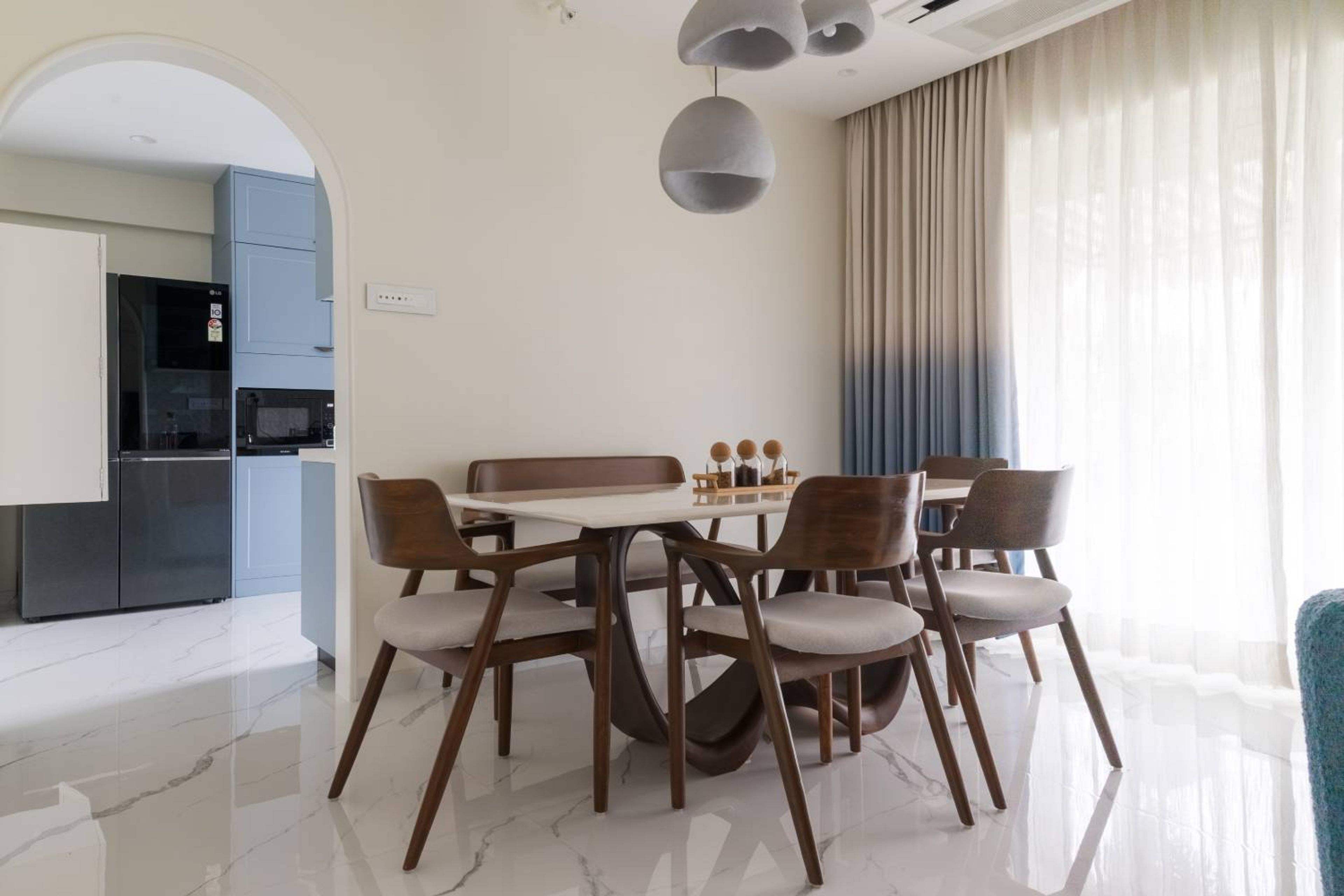 Modern Dining Room Design with Marble Table Bench Seating and Sculptural Table