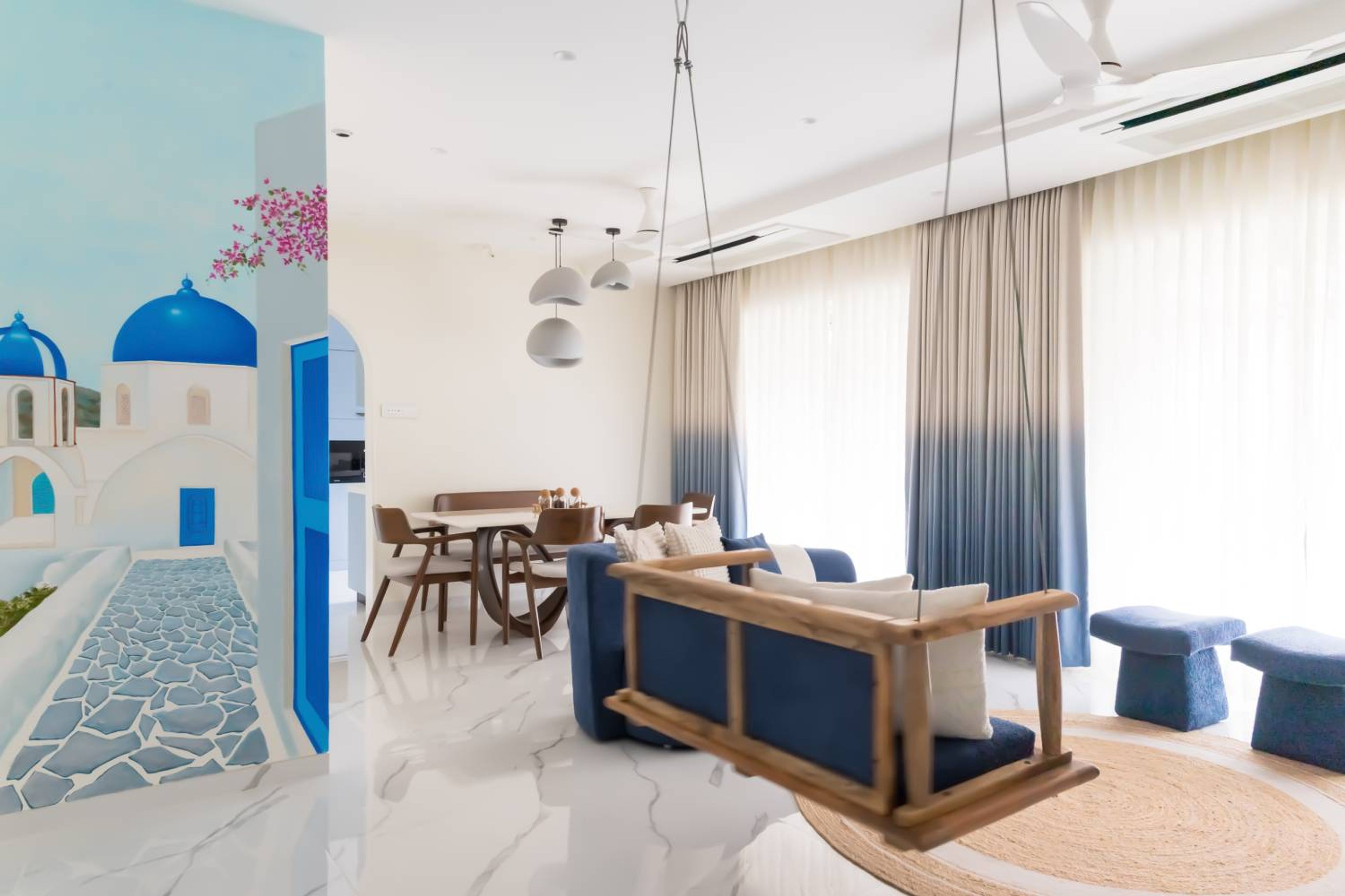 Living Room Design with Blue Swing and Santorini Wall Mural