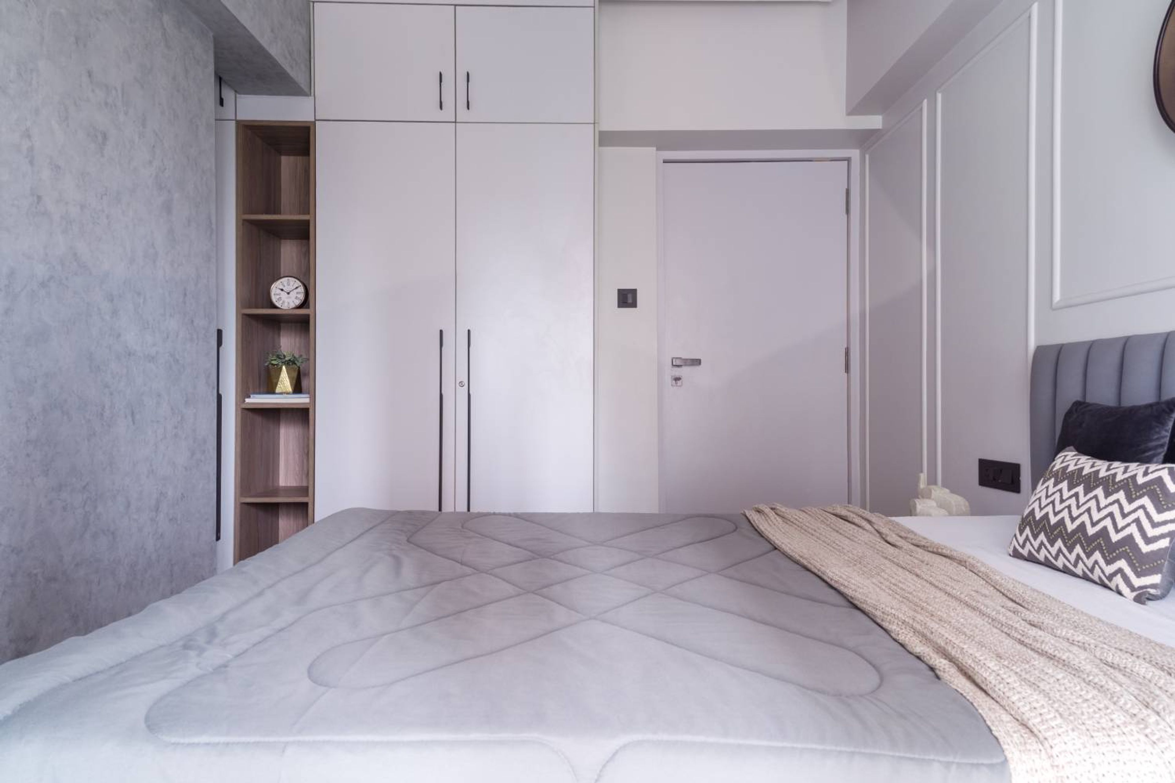 White and Walnut 2-Door Swing Wardrobe Design with Gold Handles and Suede Finish