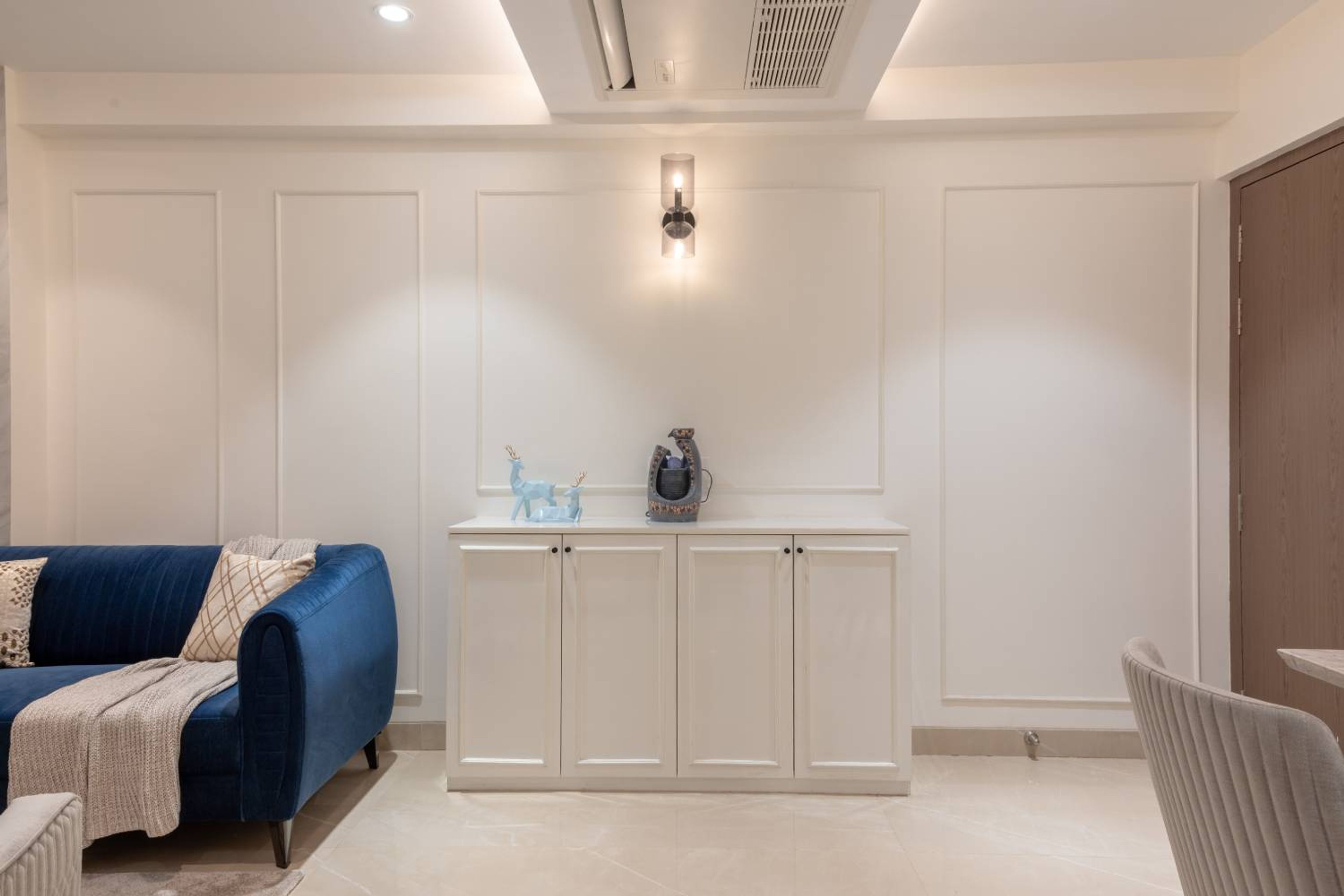 Living Room Design with Off-White Storage Unit and Off-White Wall with Trims