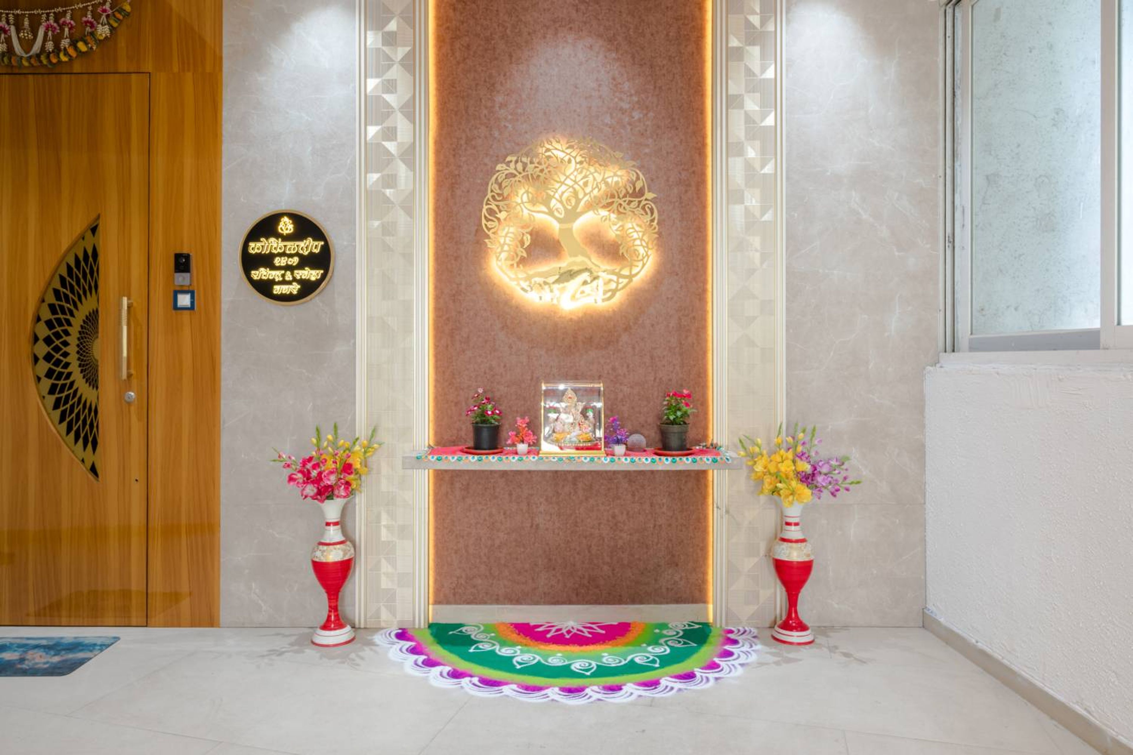 Pooja space with wall mounted shelf and brown textured backsplash wall