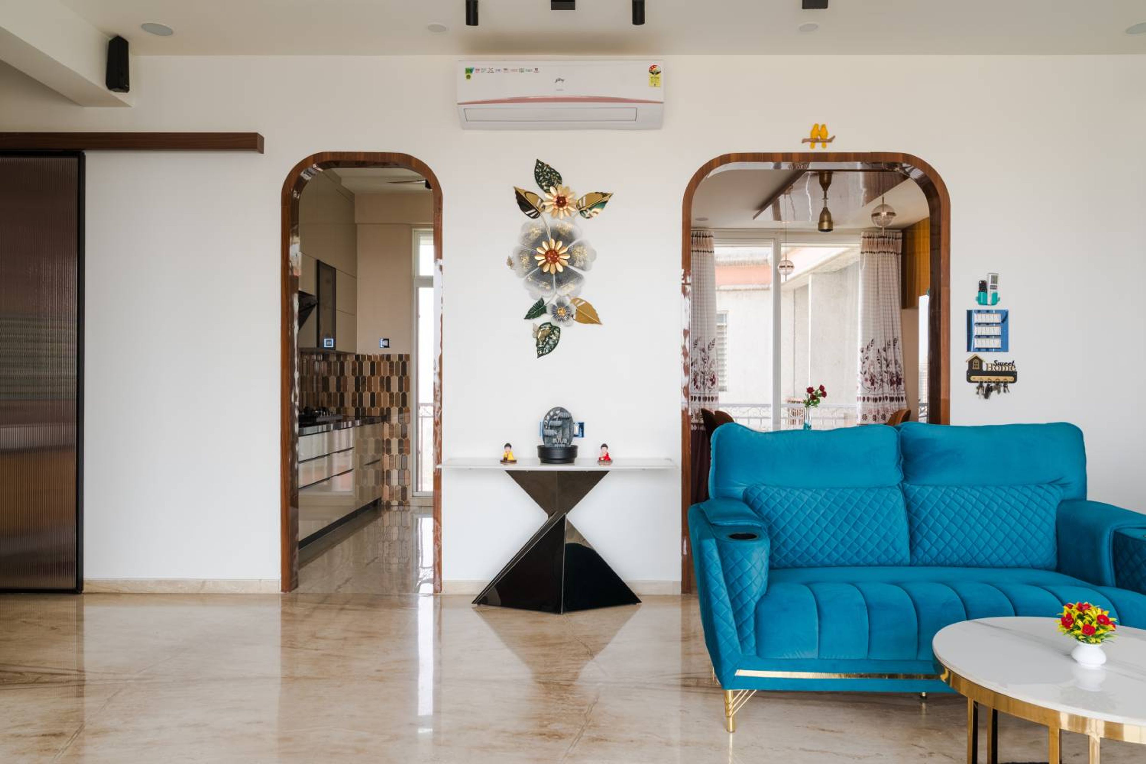 Living room design with 2-seater blue sofa