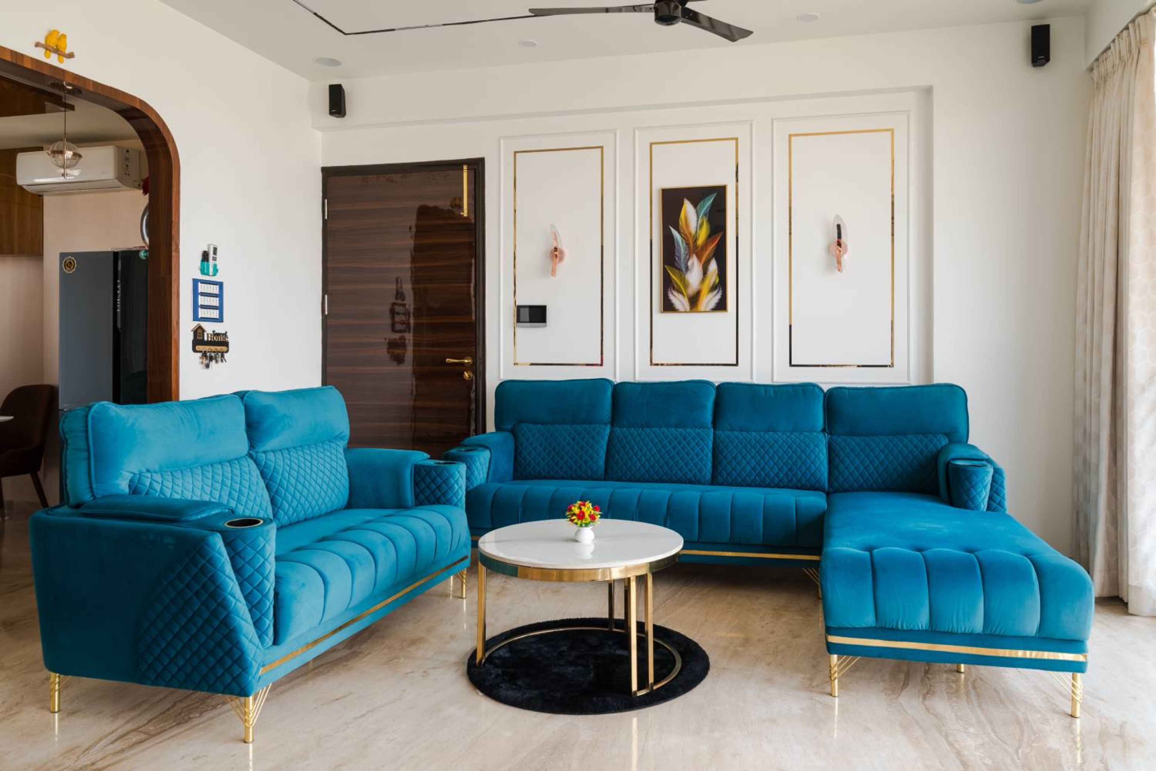Living room design with L-shaped blue sofa