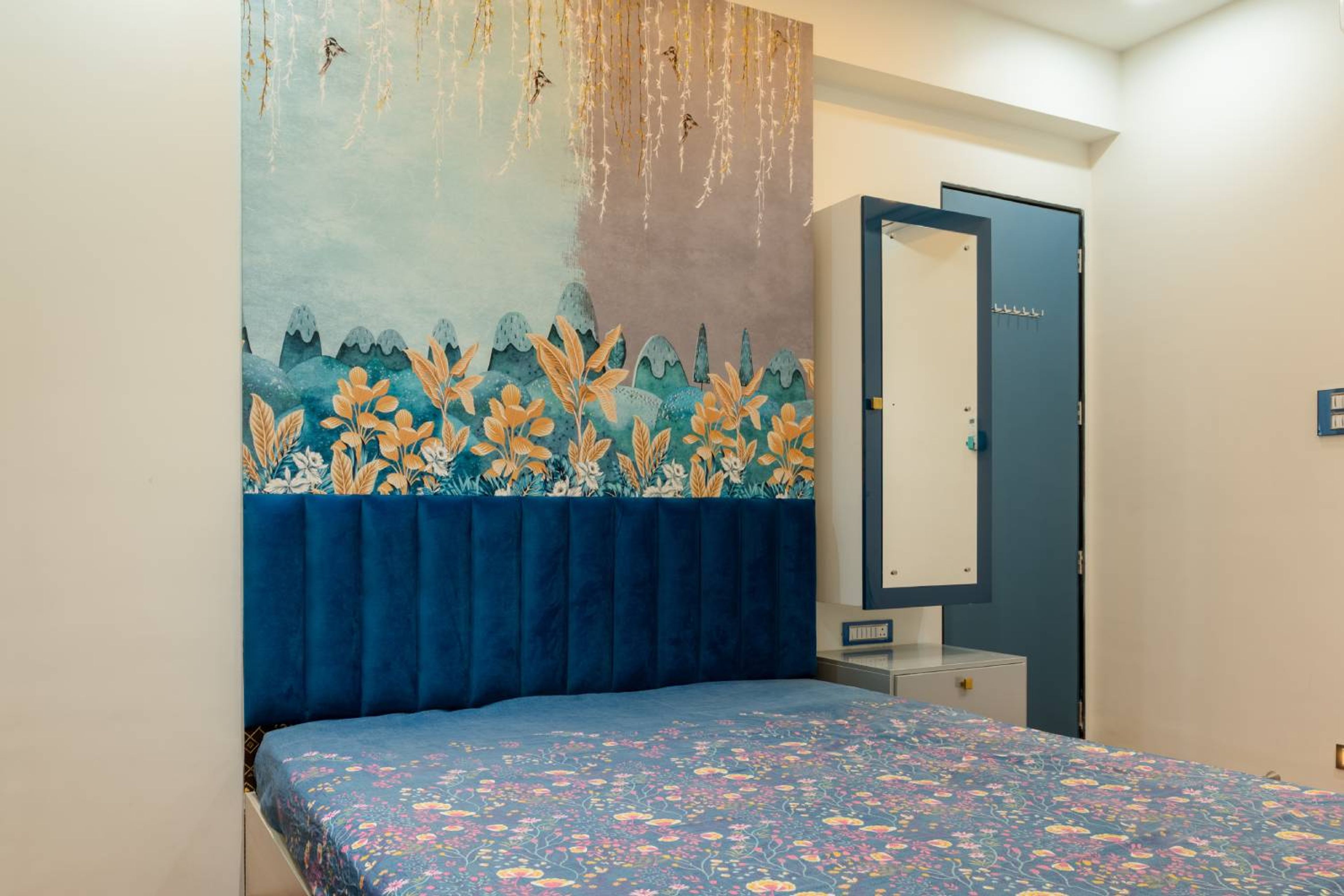Bedroom design with floral patterned headboard wall