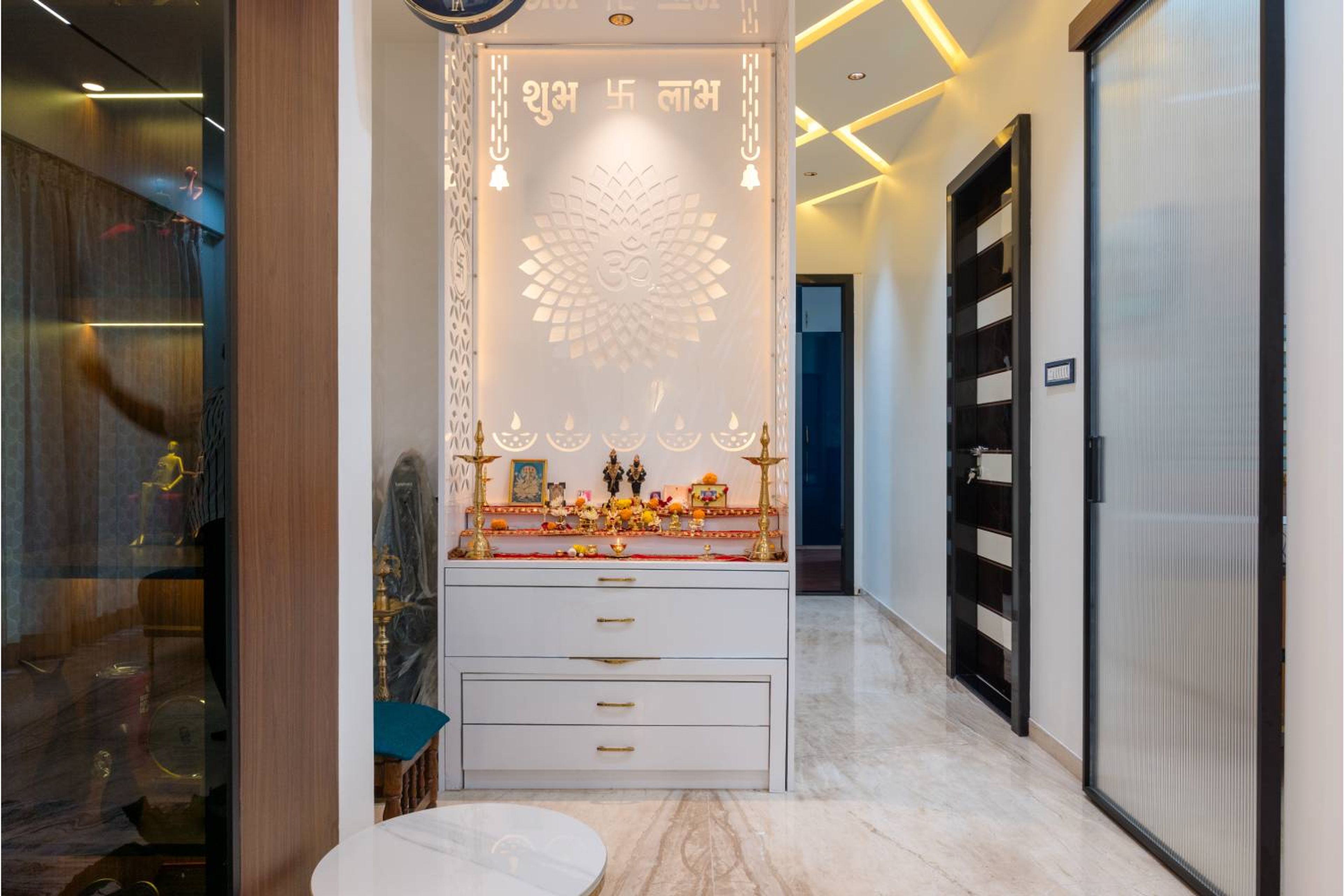 White open pooja unit with backlit design
