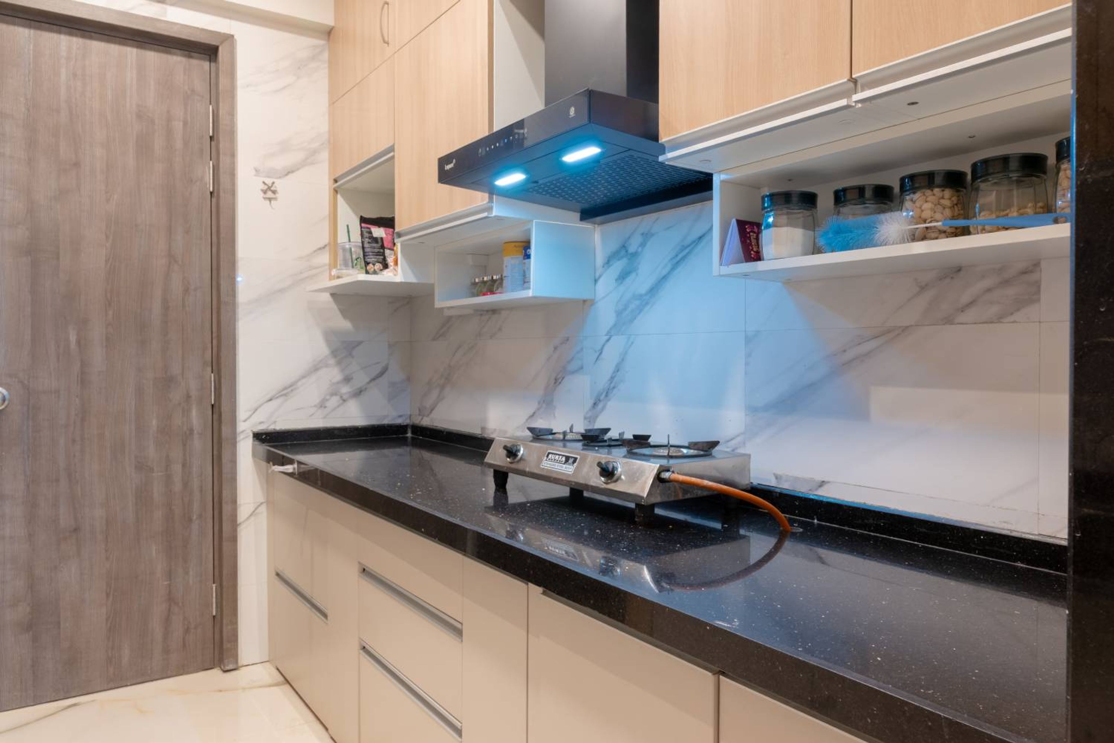 Straight Kitchen Design with Wooden and White Cabinets and Black Granite Countertop
