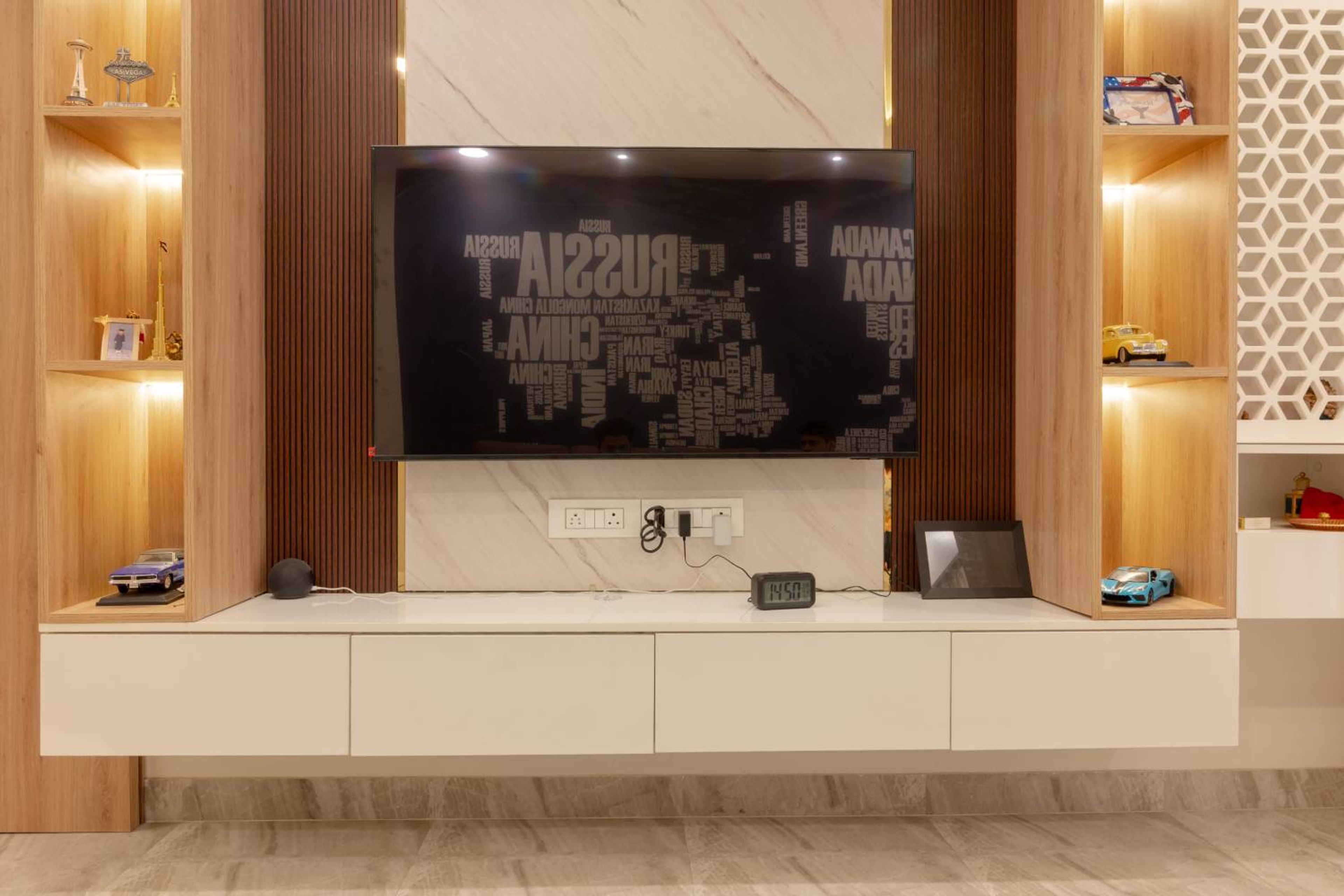 TV Unit Design with Wall-Mounted White Cabinets and Wooden Panel Backdrop