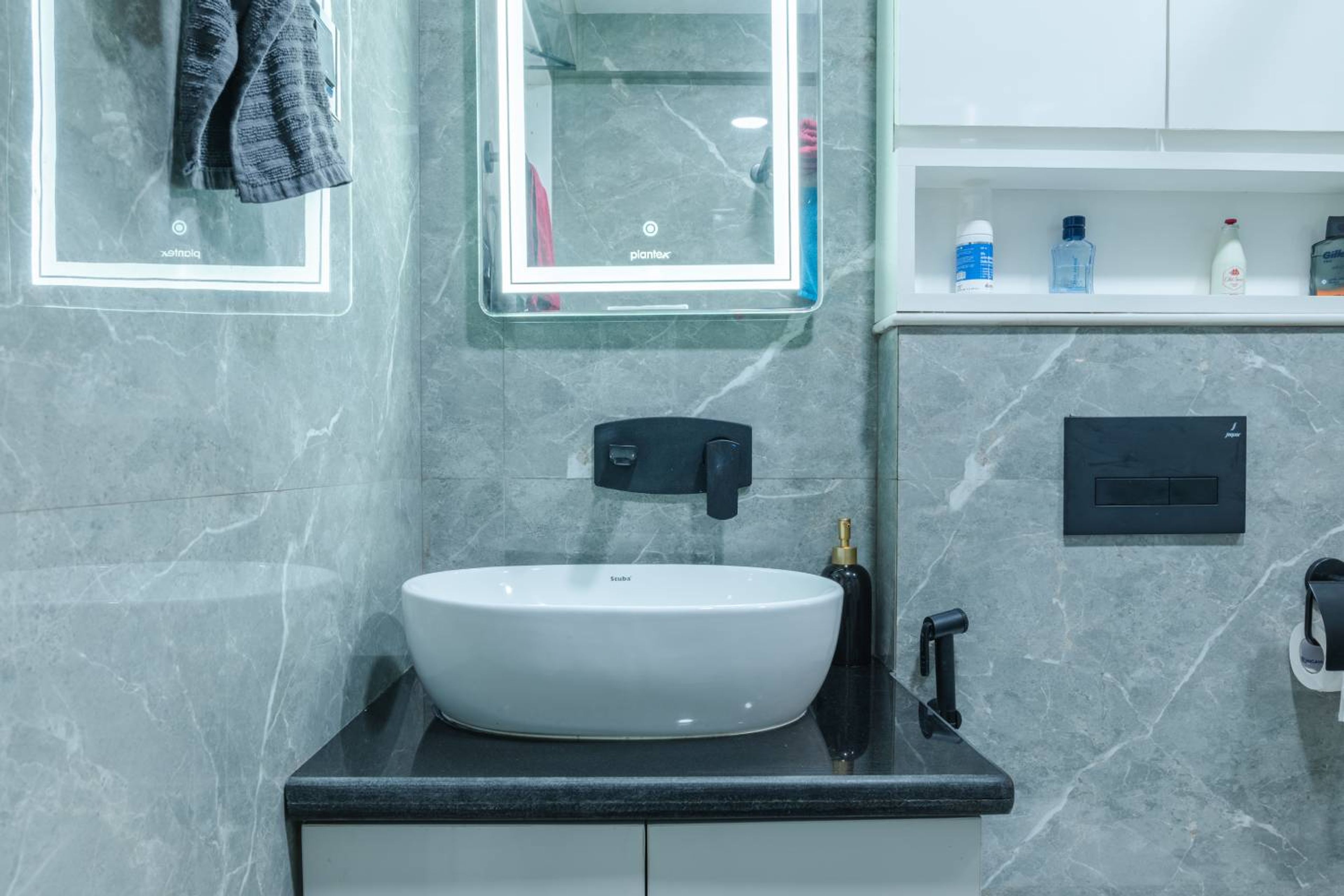 Bathroom Design with White Cabinets and Grey Marvle Patterned Walls