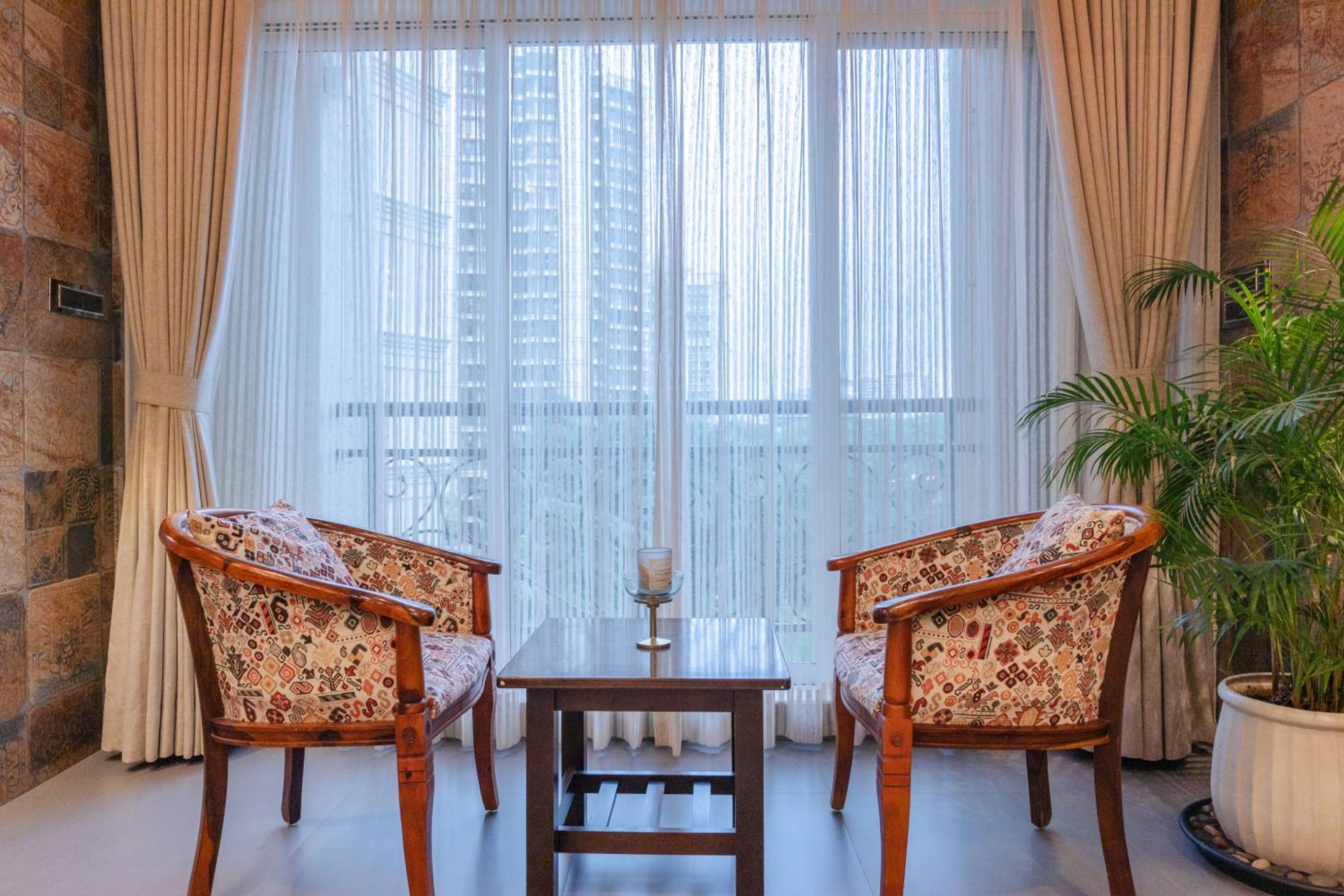 Living Room Design with Printed Wooden Chairs and Center Table