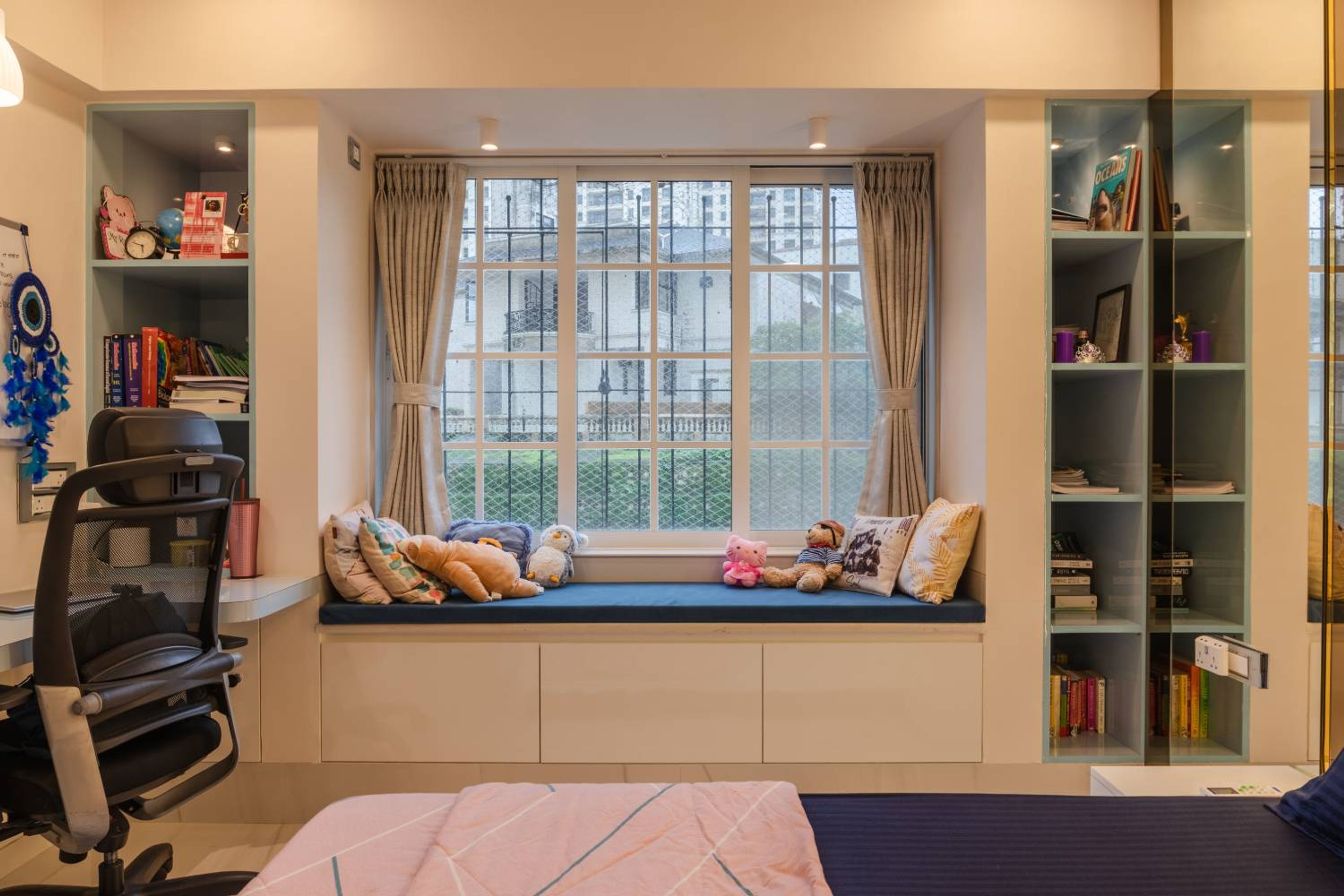 Kids Bedroom Design with Window Seating with Storage and Open Wall Shelves