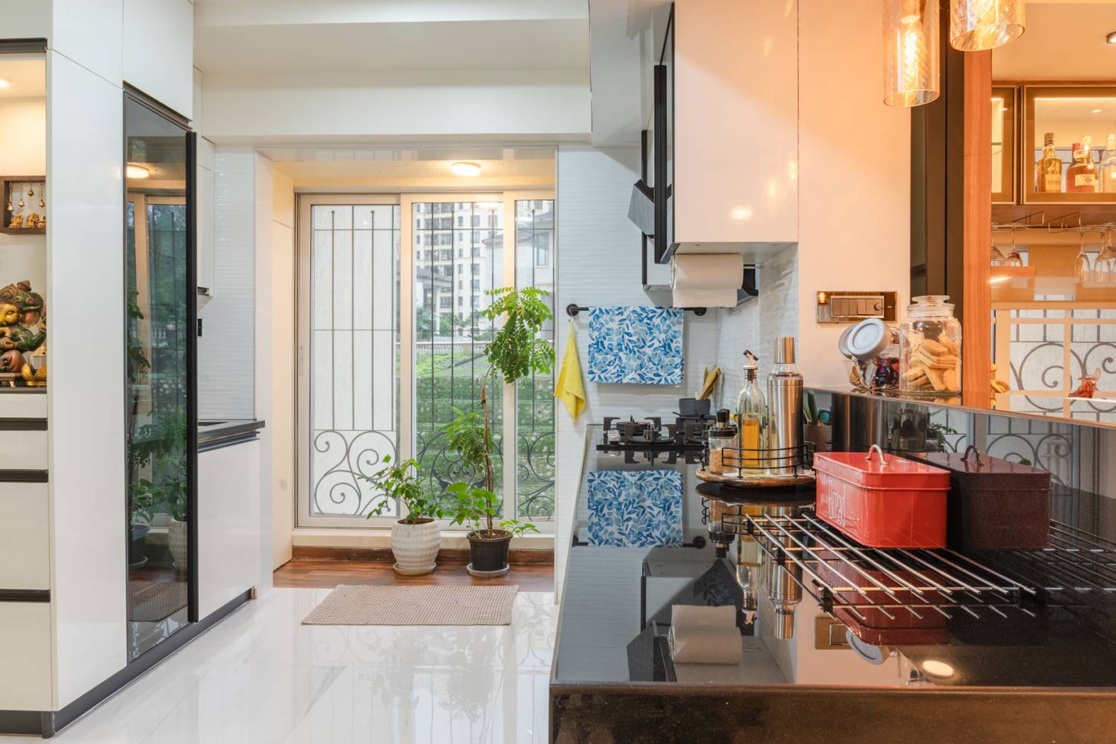L-Shaped Kitchen Design with White Crockery Unit