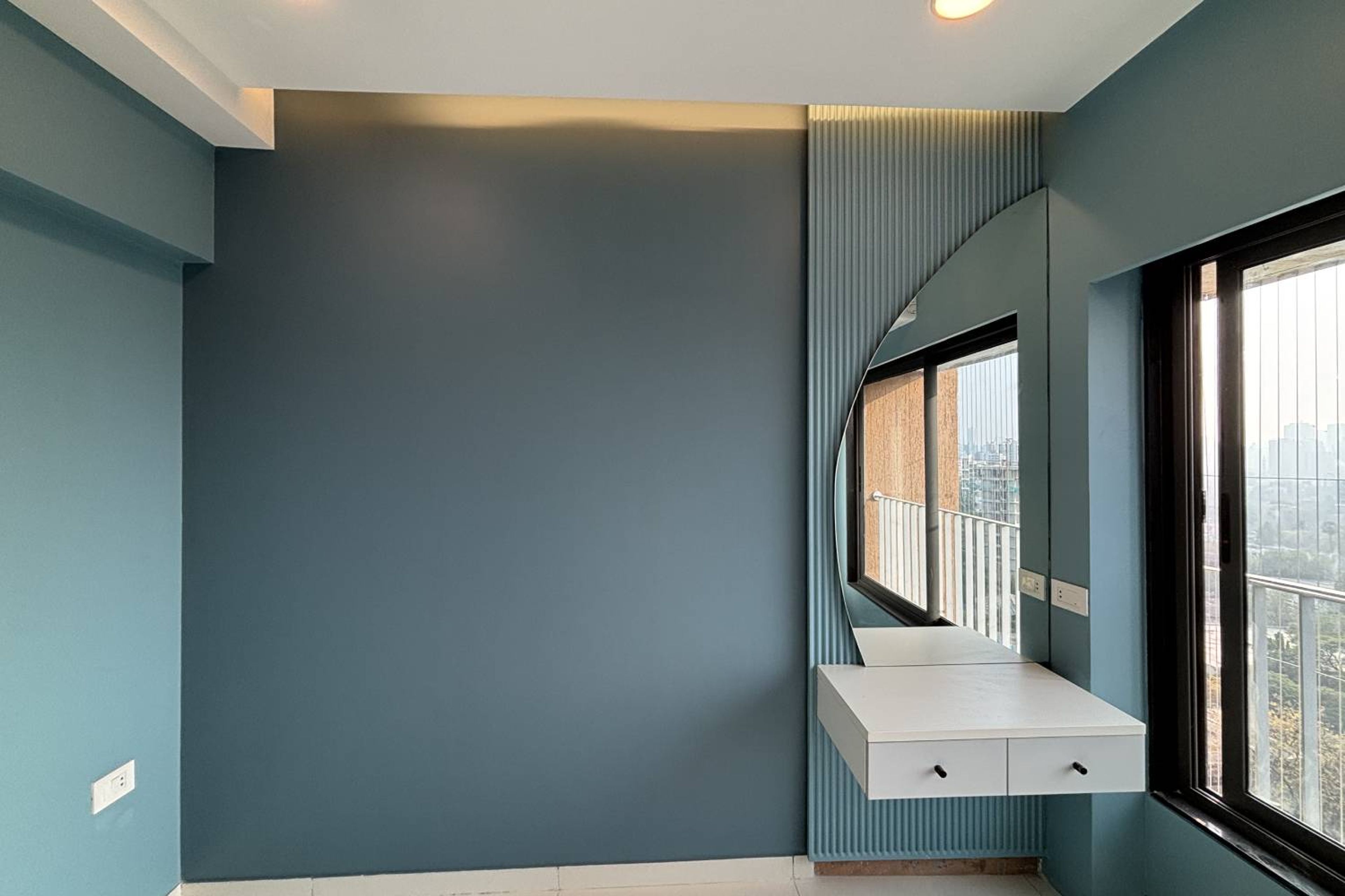 Blue Wall Design with Wall Slats and Crescent Moon Dressing Mirror