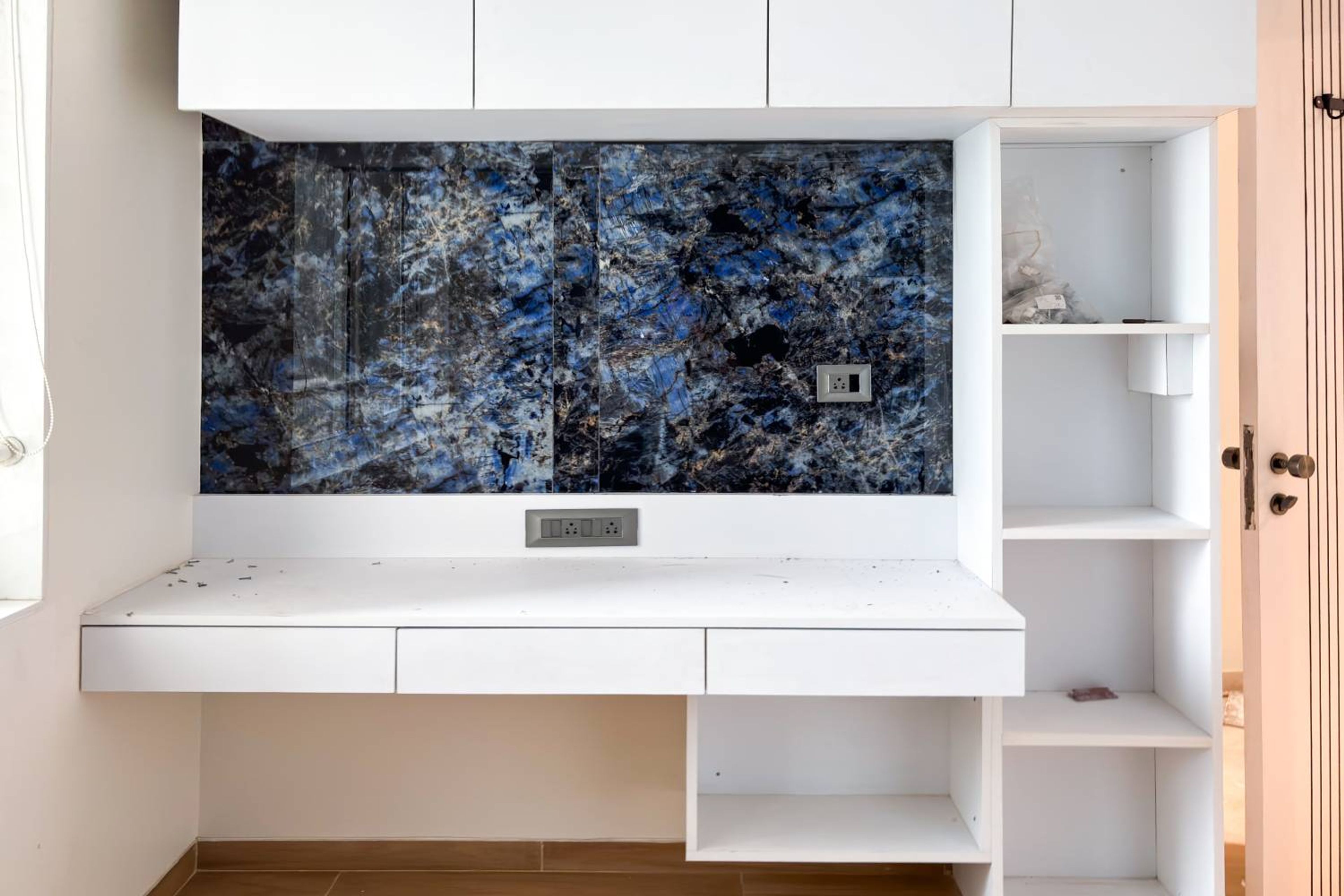 Grey study space with wall mounted shelves