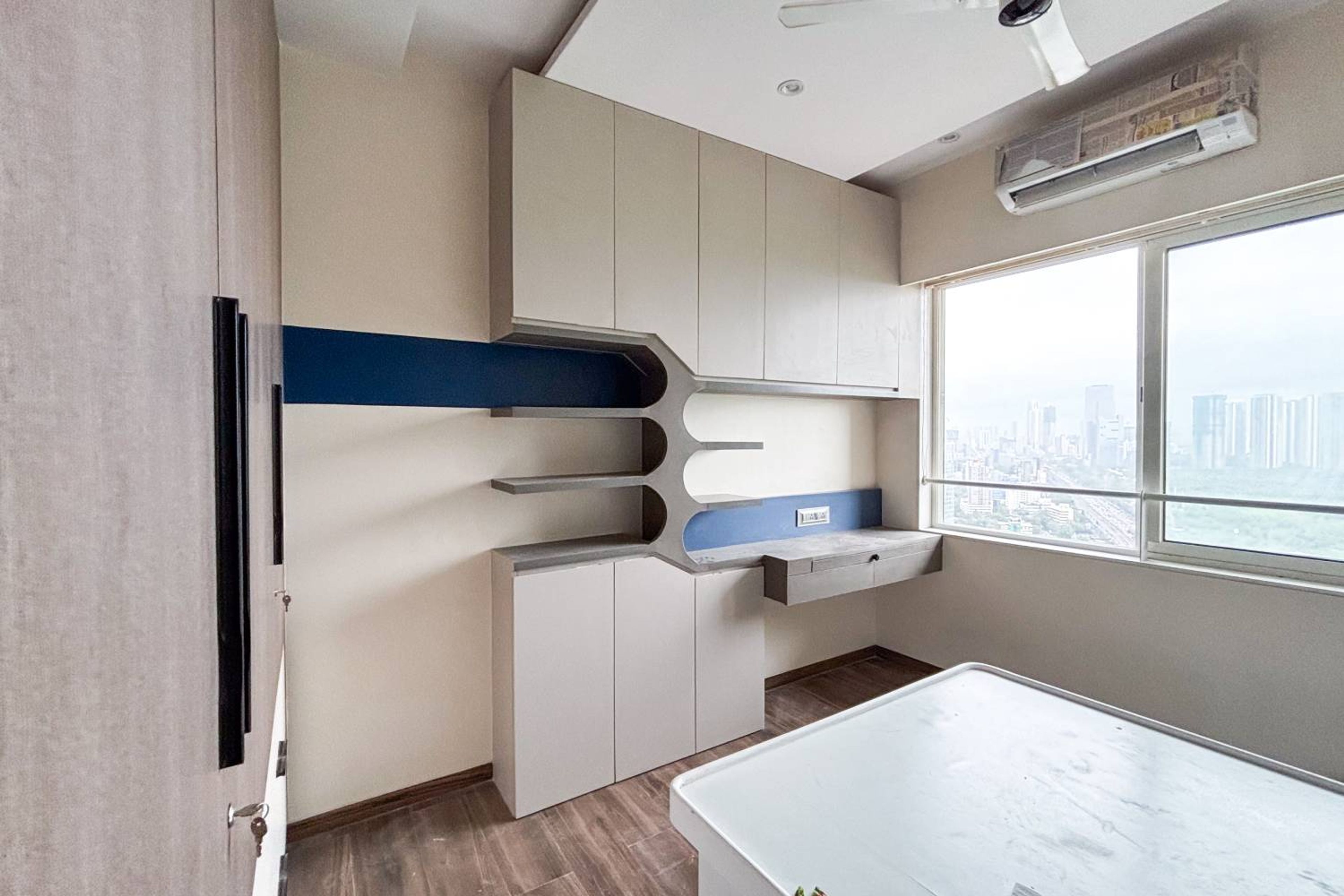 Grey study space with wall mounted shelves